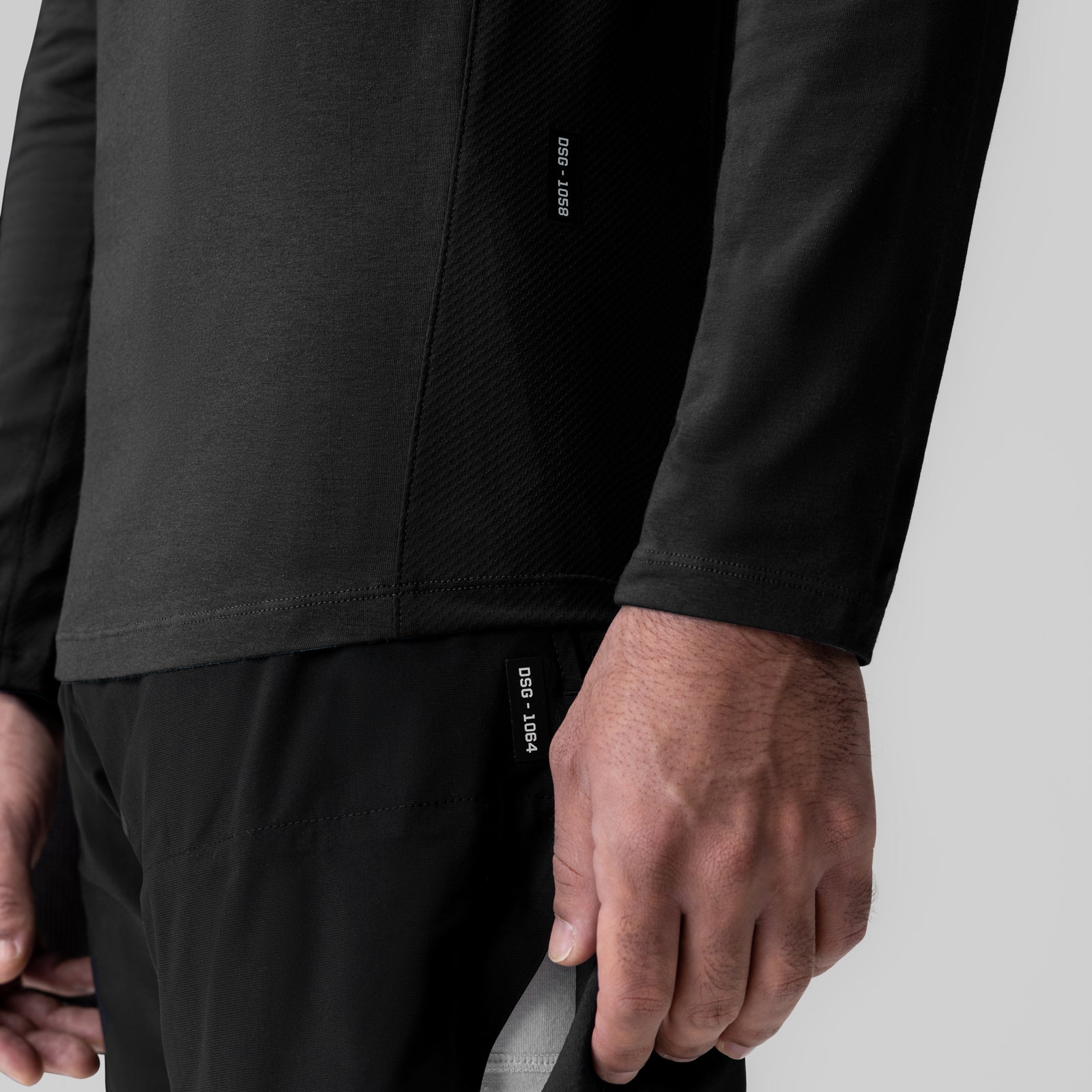 Black Creora® Cotton Modal Long Sleeve worn by model, closeup of sleeve and torso detail