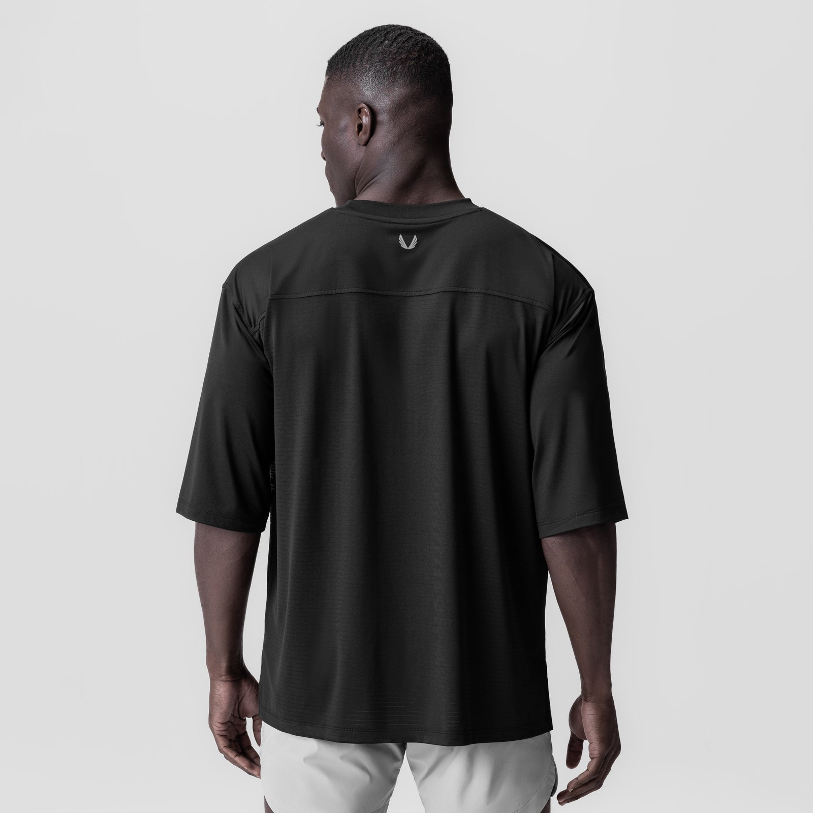 Black 3D-Lite® 2.0 Lycra® 3/4-sleeve oversized tee worn by model, back view