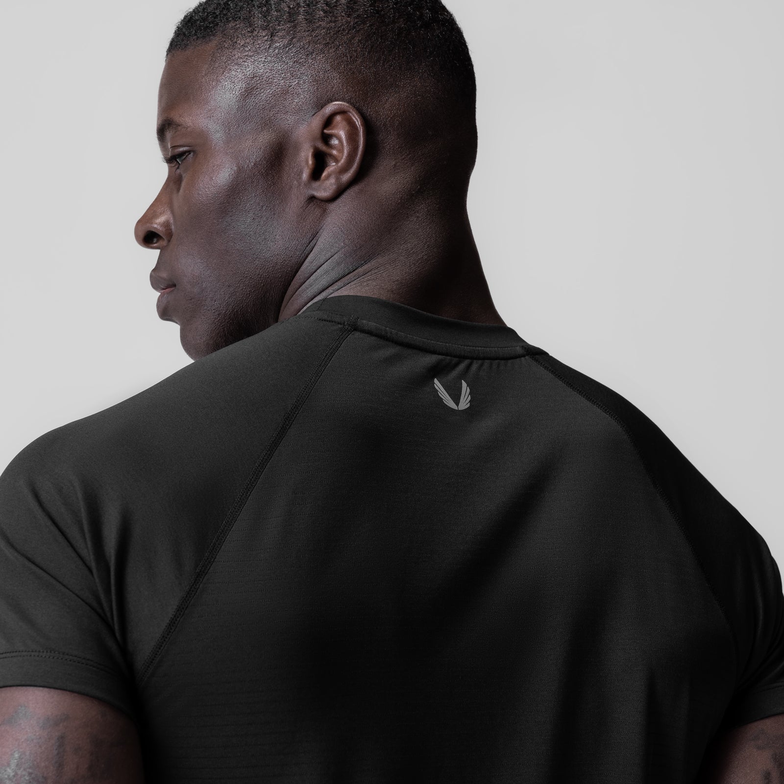 3D-Lite 2.0 Lycra Fitted Tee in black, worn by model in profile view