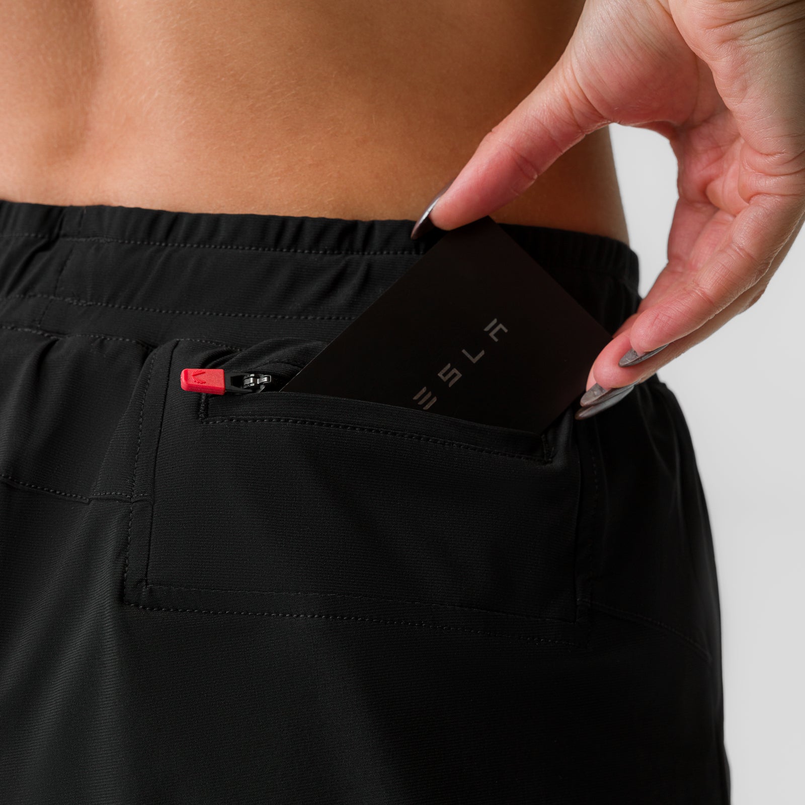 Black ASRV Tetra-Lite 4" Liner Short worn by model, detail shot of pocket