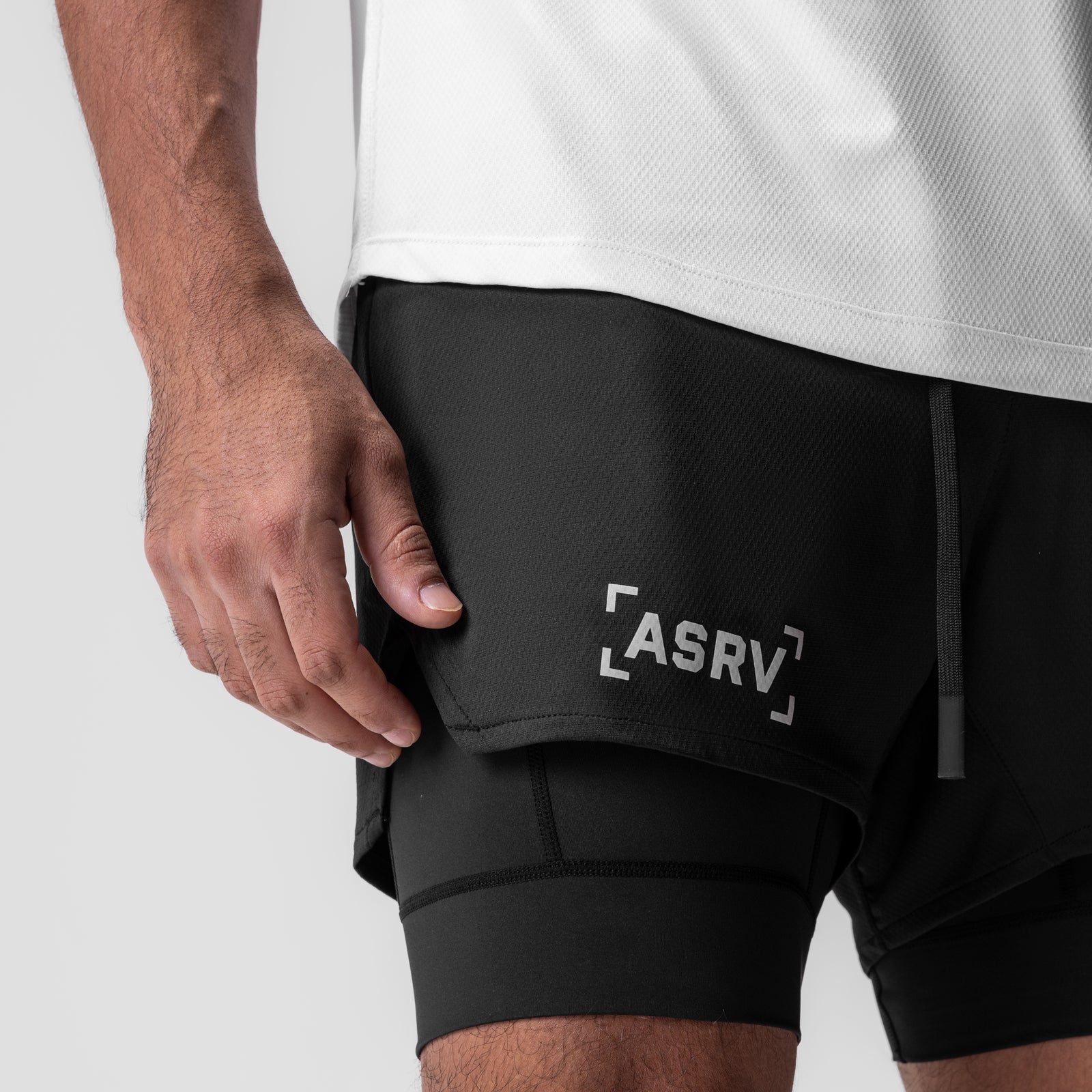 AeroSilver 5" Liner Short in black, worn by model showing side pocket detail