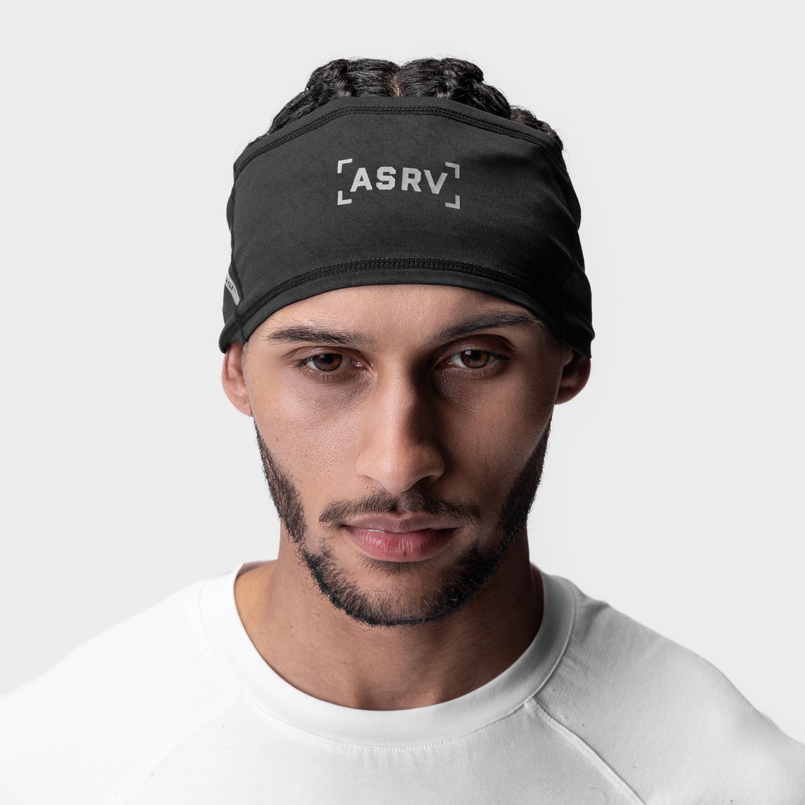 ASRV x Outlast Phase Change Headband in black with reflective logo, worn by model