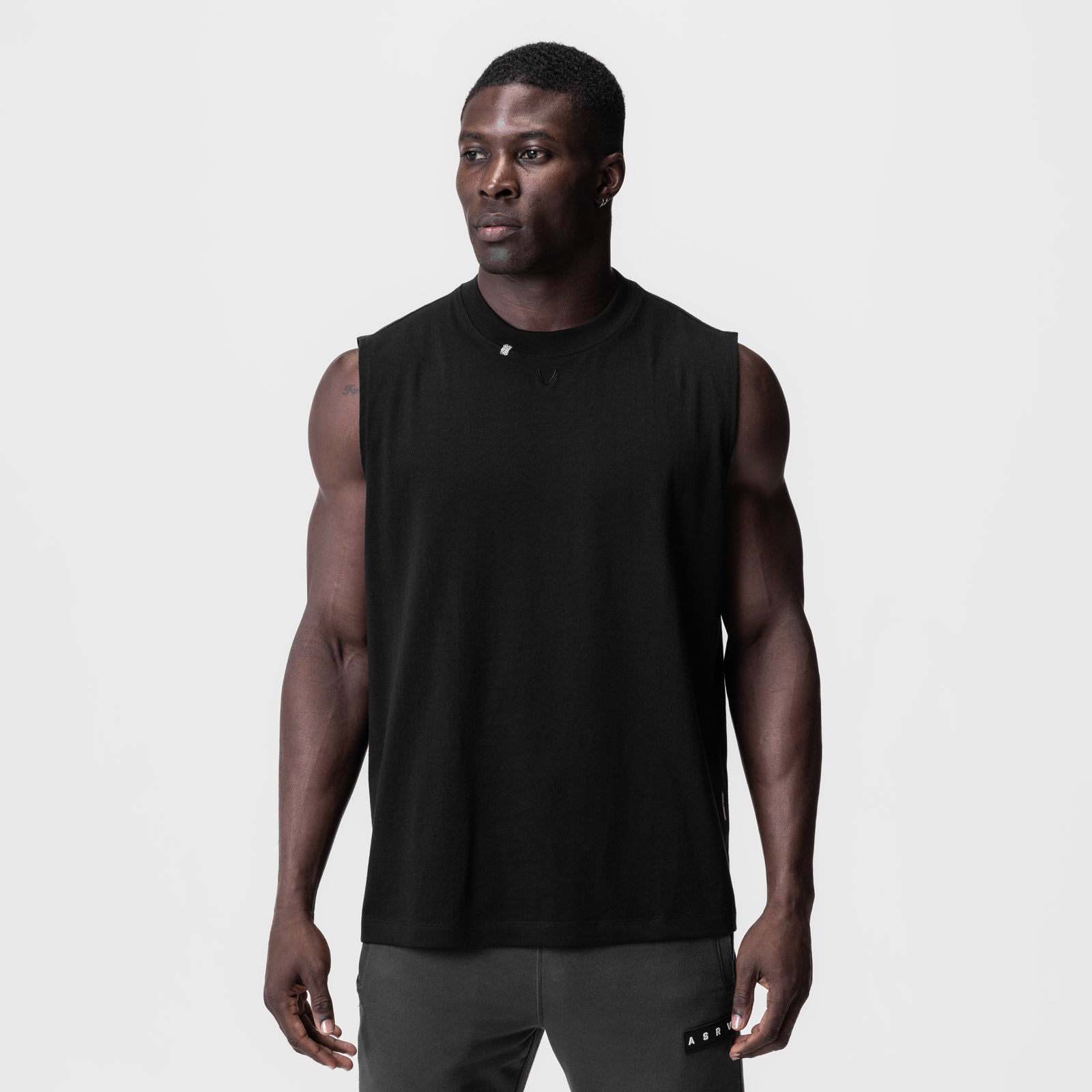 Black Tech Essential Relaxed Cutoff sleeveless tank on model, front view