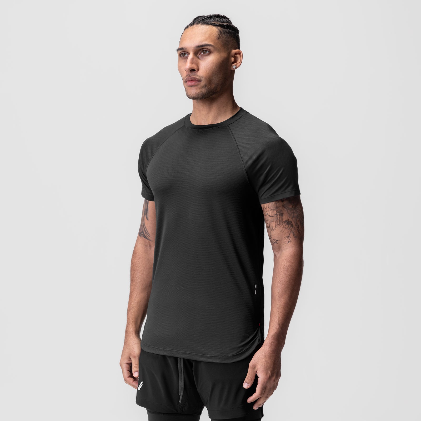 AeroSilver Established Tee in black, worn by model in three-quarter front view