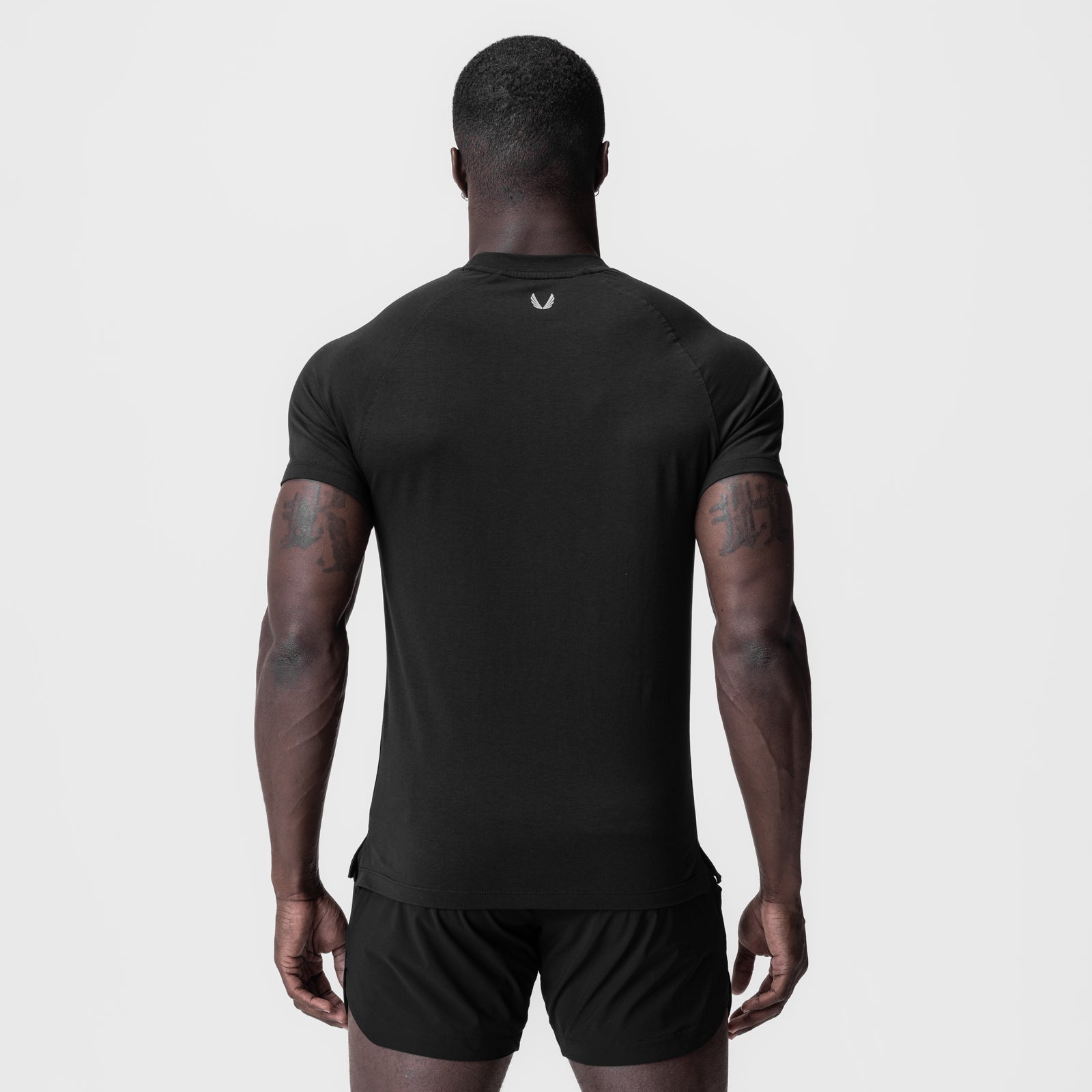 Black Supima® Fitted Tee worn by model, back view