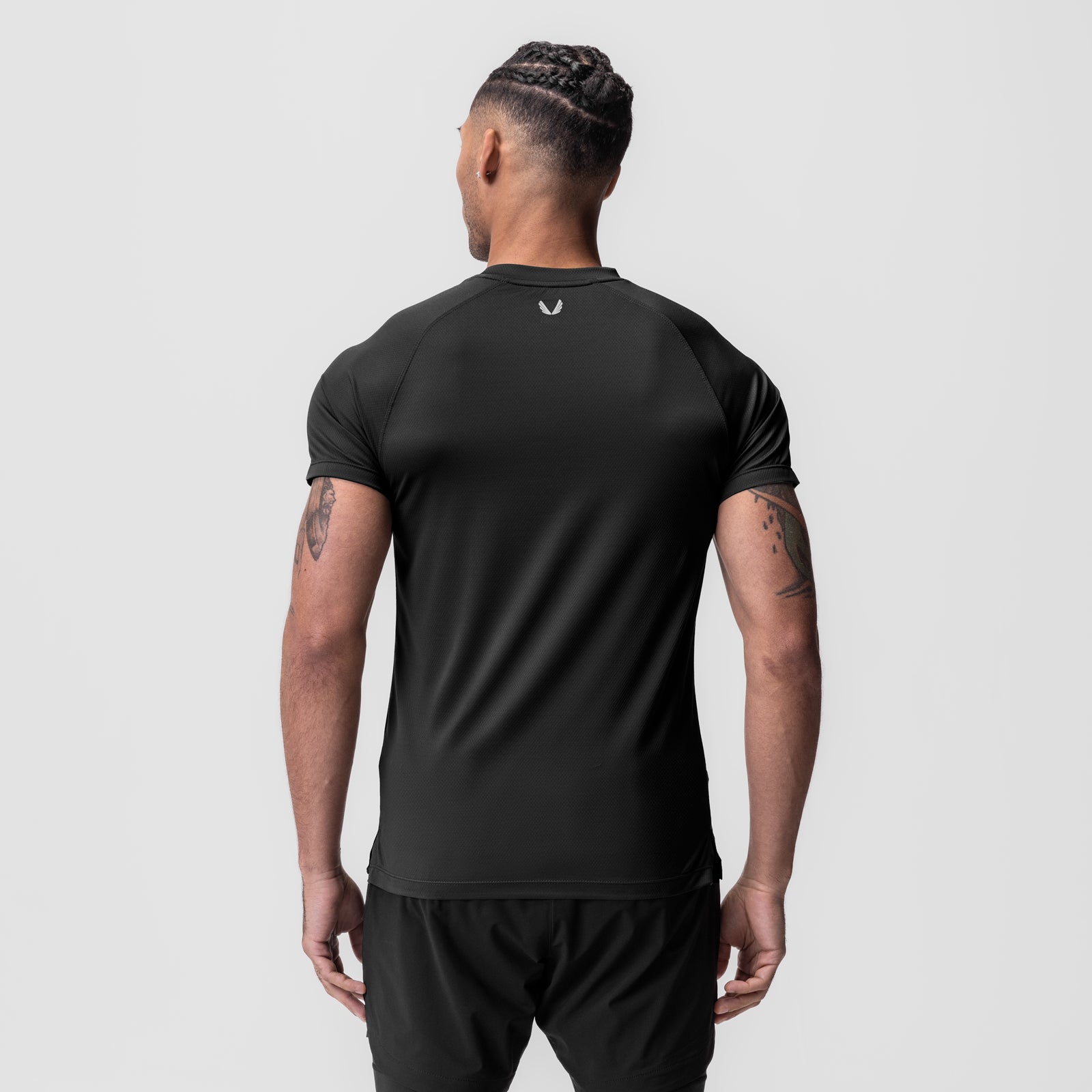 AeroSilver Fitted Tee in black worn by model, back view
