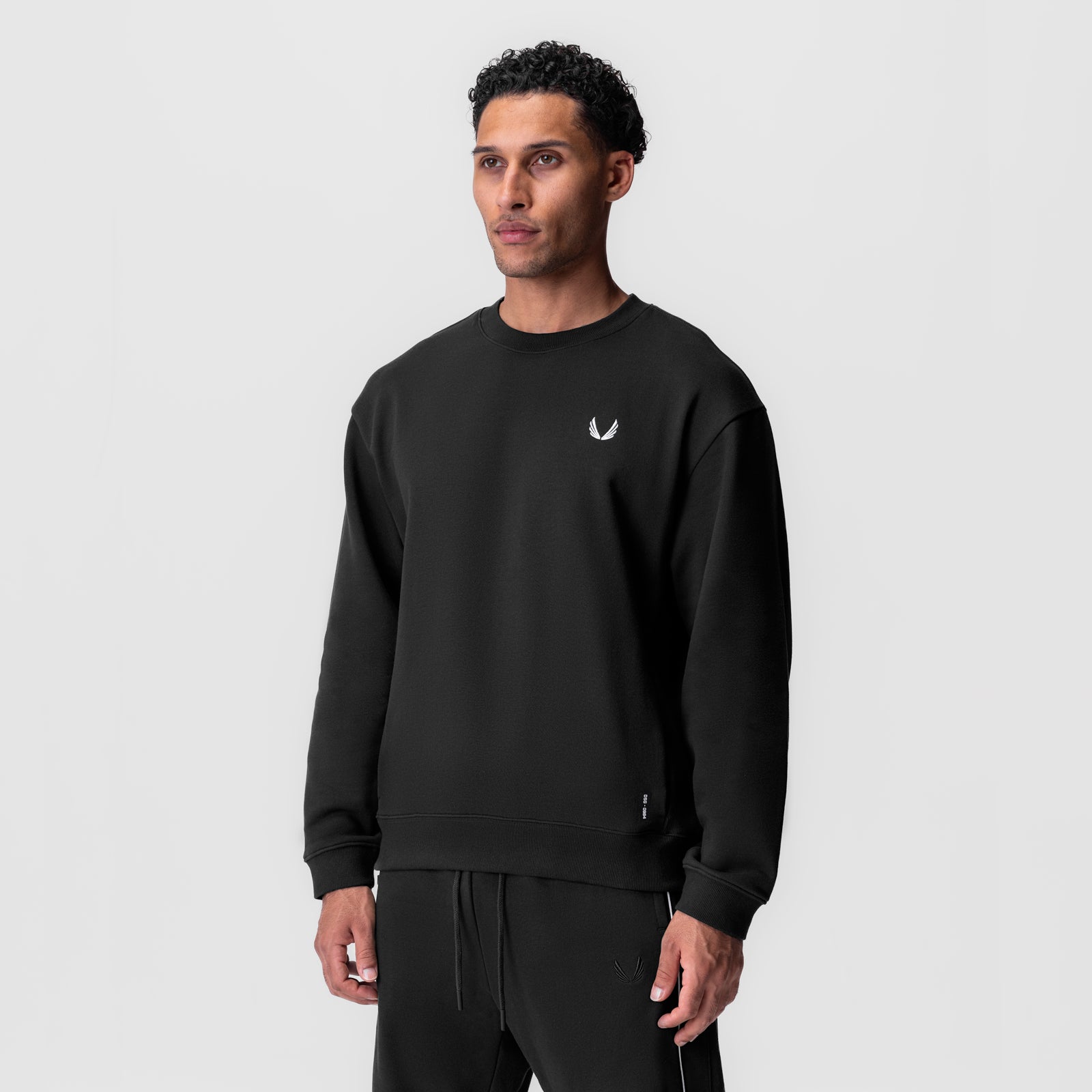 Herringbone Terry Crewneck in black worn by model, front view