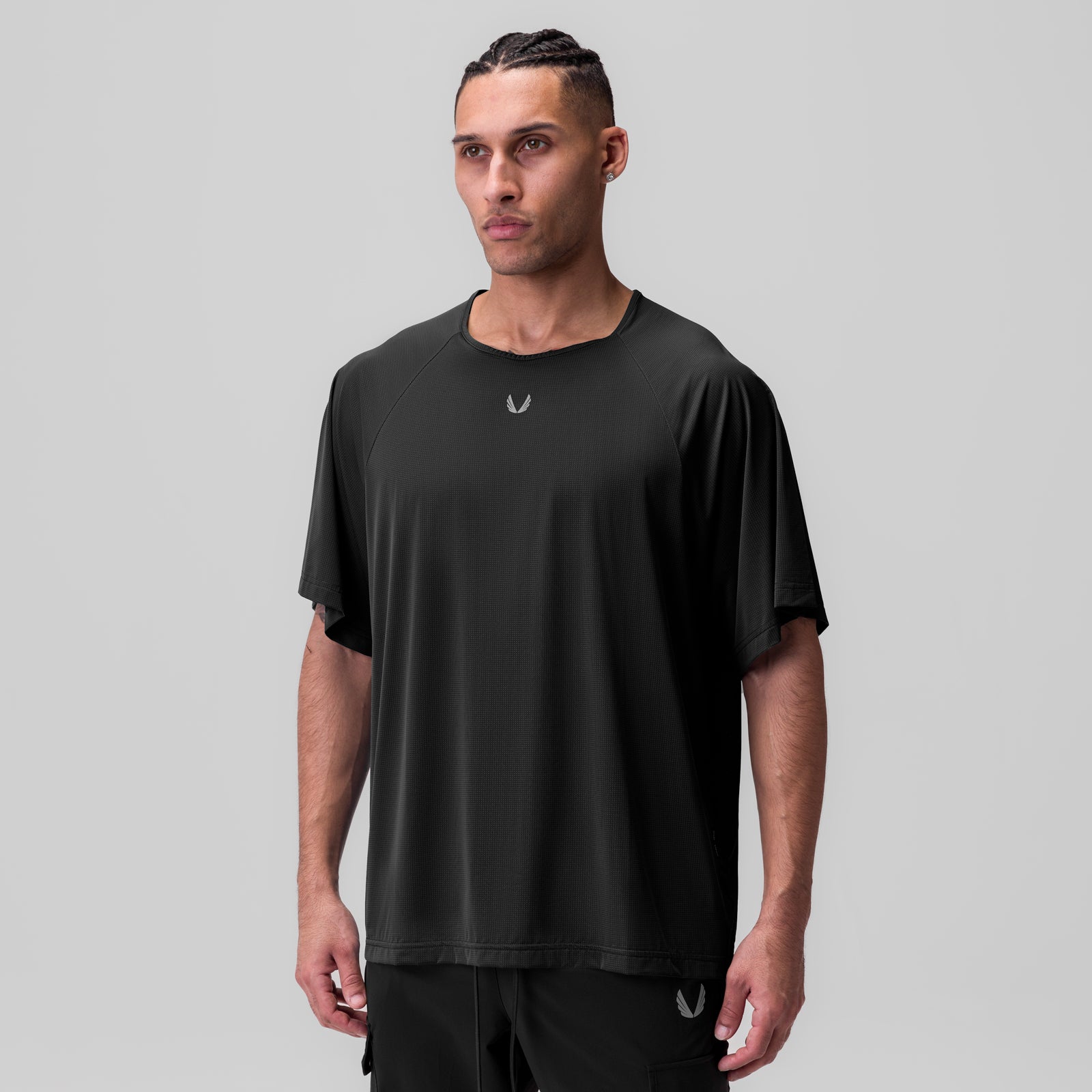 Ice-Skin™ Oversized Tee in black, worn by model facing forward