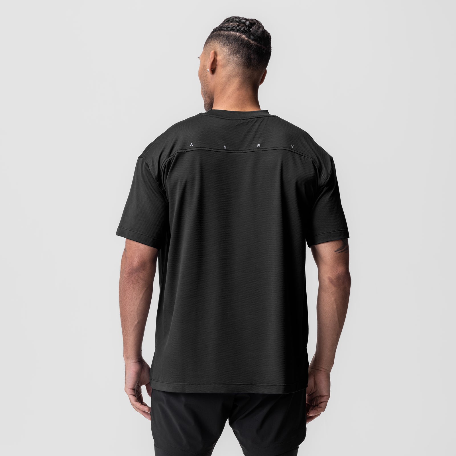 AeroSilver Oversized Tee in black worn by model, back view