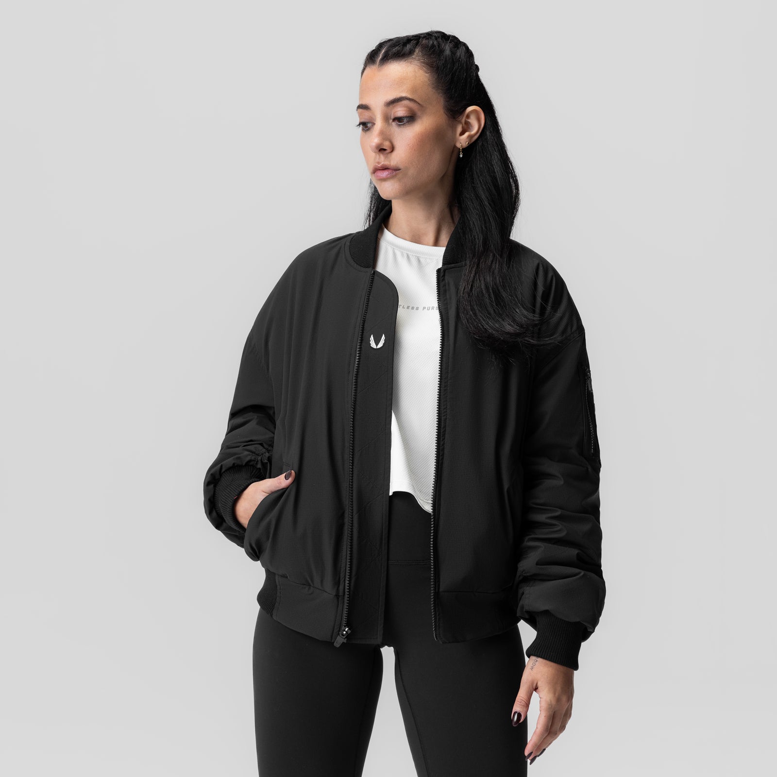 Women's Sherpa-Lined Insulated Bomber Jacket in black, worn with white tee, front view