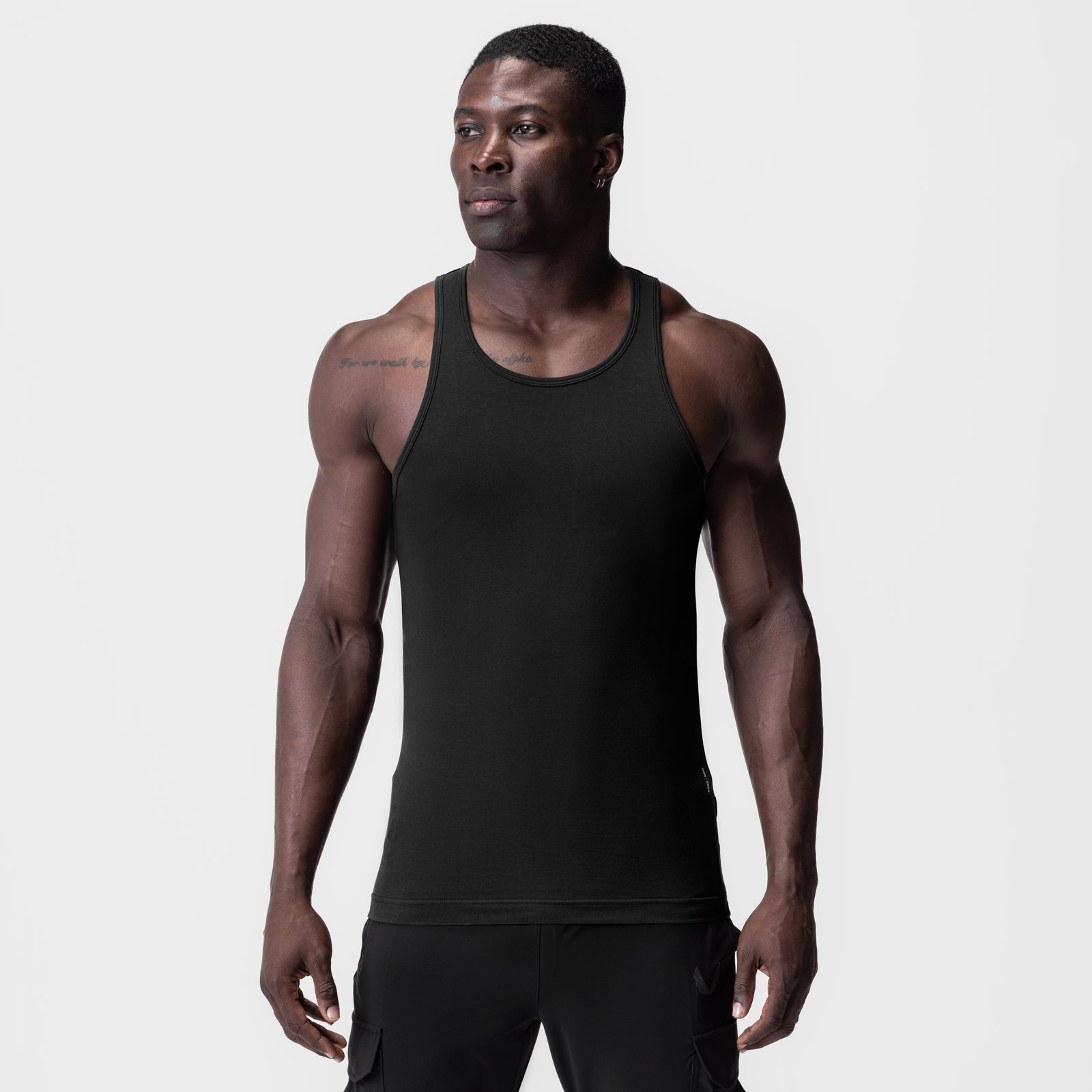 Supima® Essential Slim Tank in black, worn by model, front view