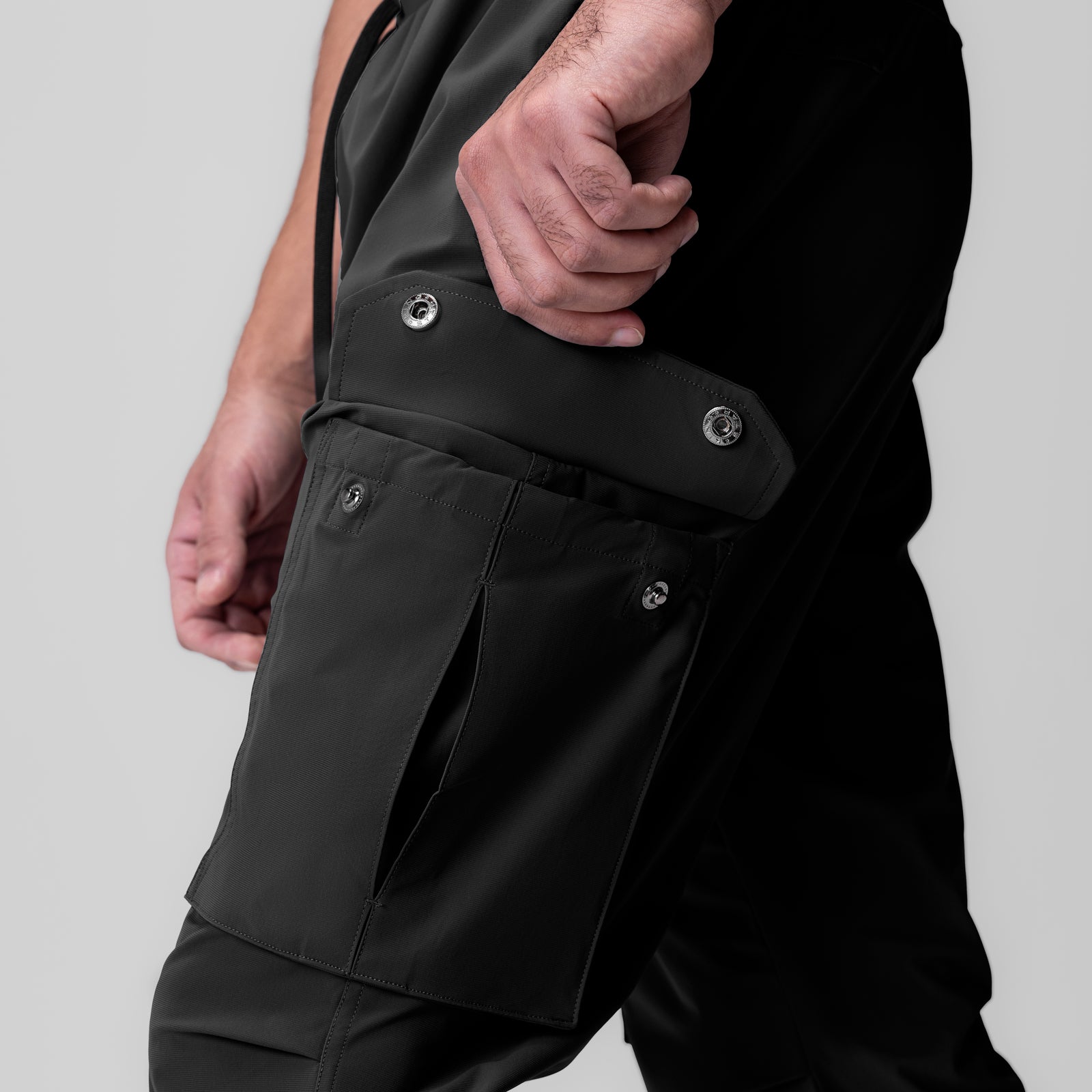 Black Tetra-Lite® Ice Cargo High Rib Jogger worn by model, side detail view showing cargo pocket