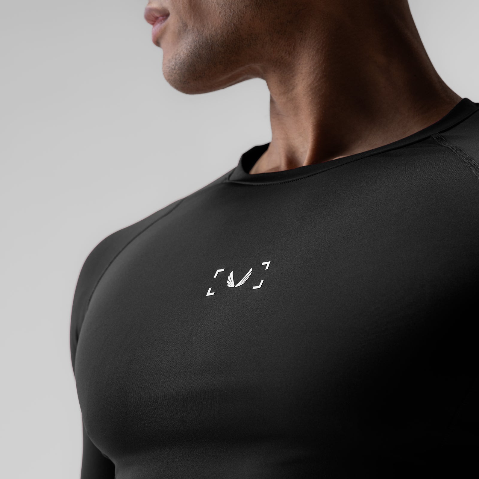 WarpFlexx-Lite® Half-Sleeve Baselayer in black, worn by model in side profile