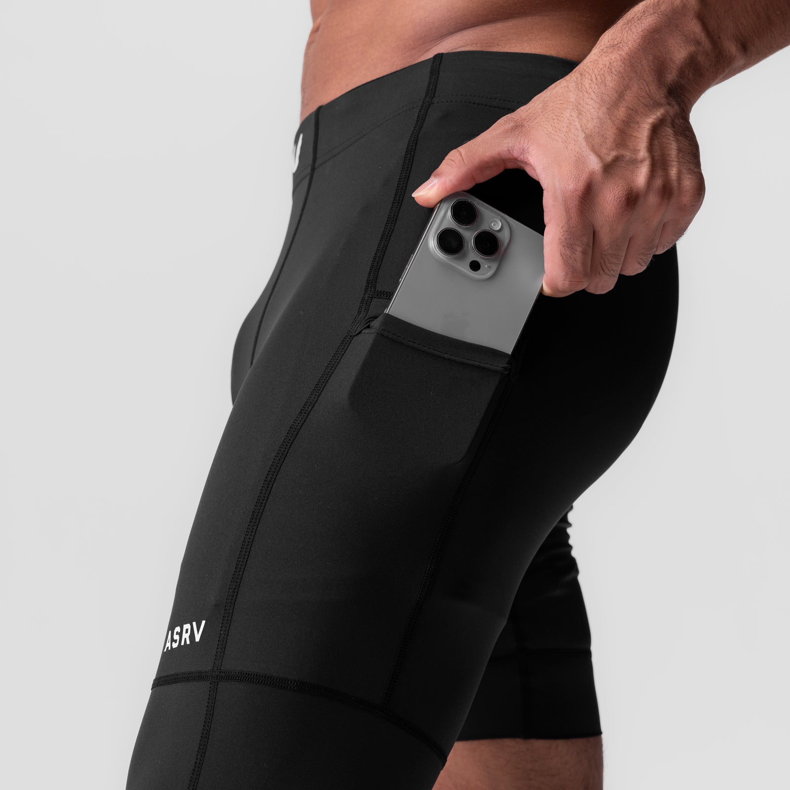 WarpFlexx-Lite Single Legging in black worn by model, side view showing phone pocket