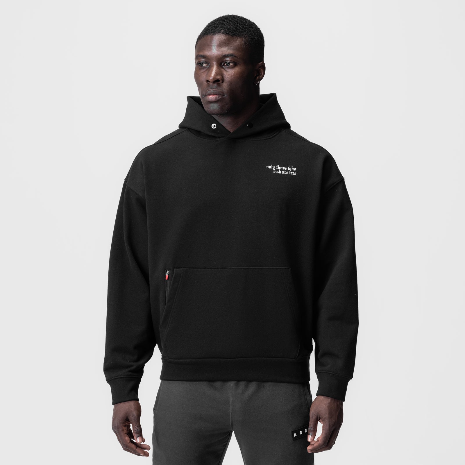 Tech-Terry Zip Pocket Hoodie in black worn by male model, front view