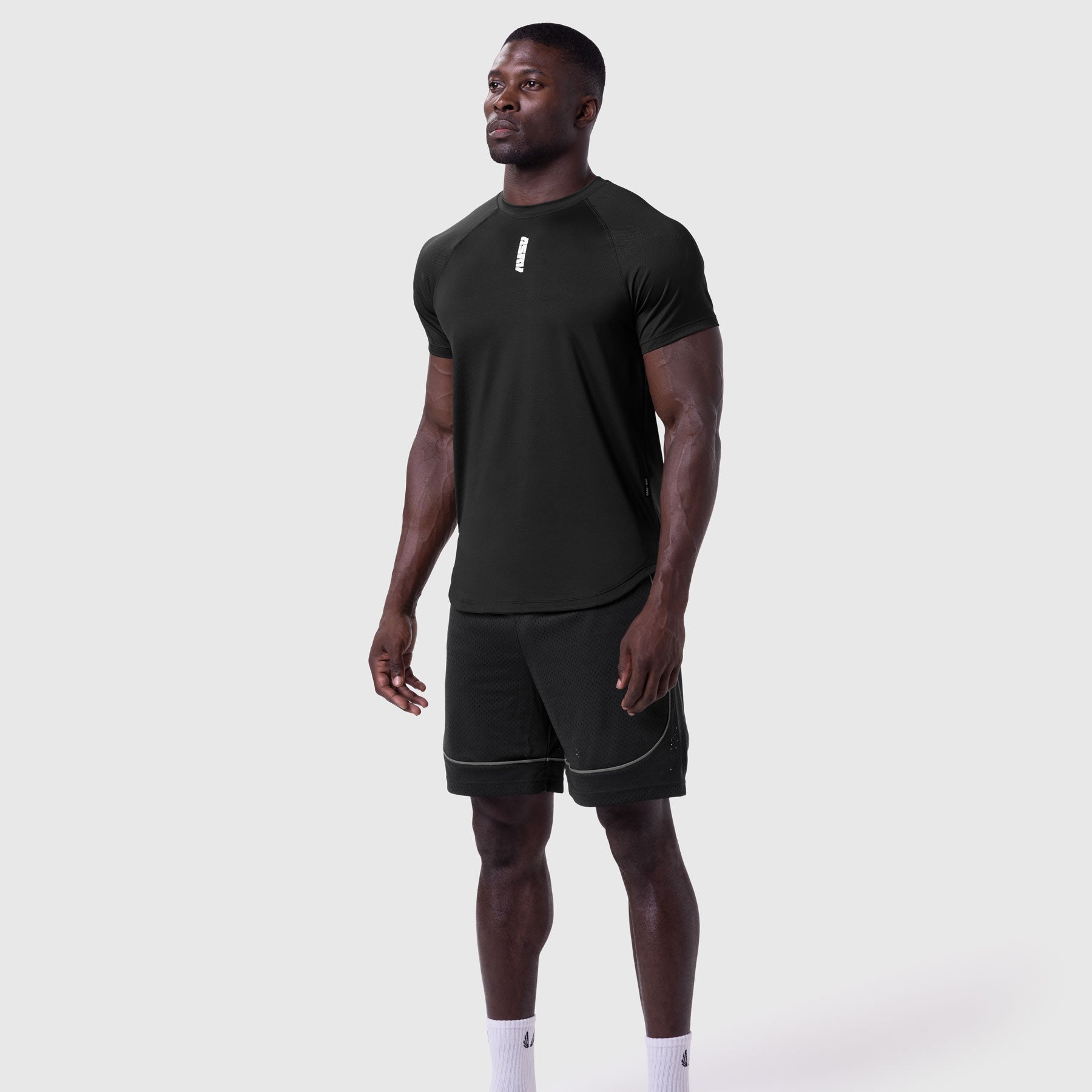 AeroSilver Established Tee in black worn with black shorts, front view on model