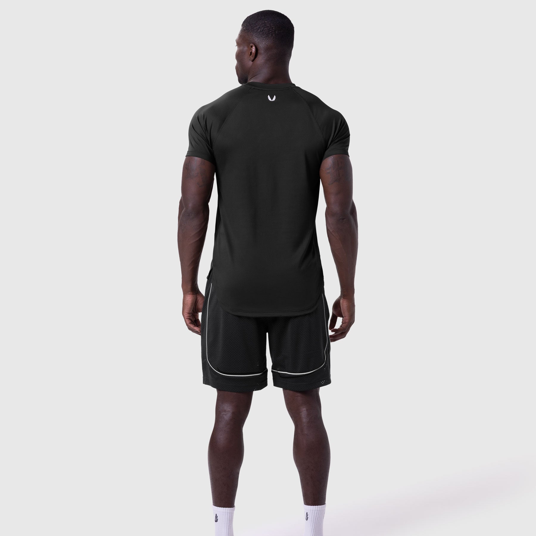 AeroSilver Established Tee in black worn by model, back view