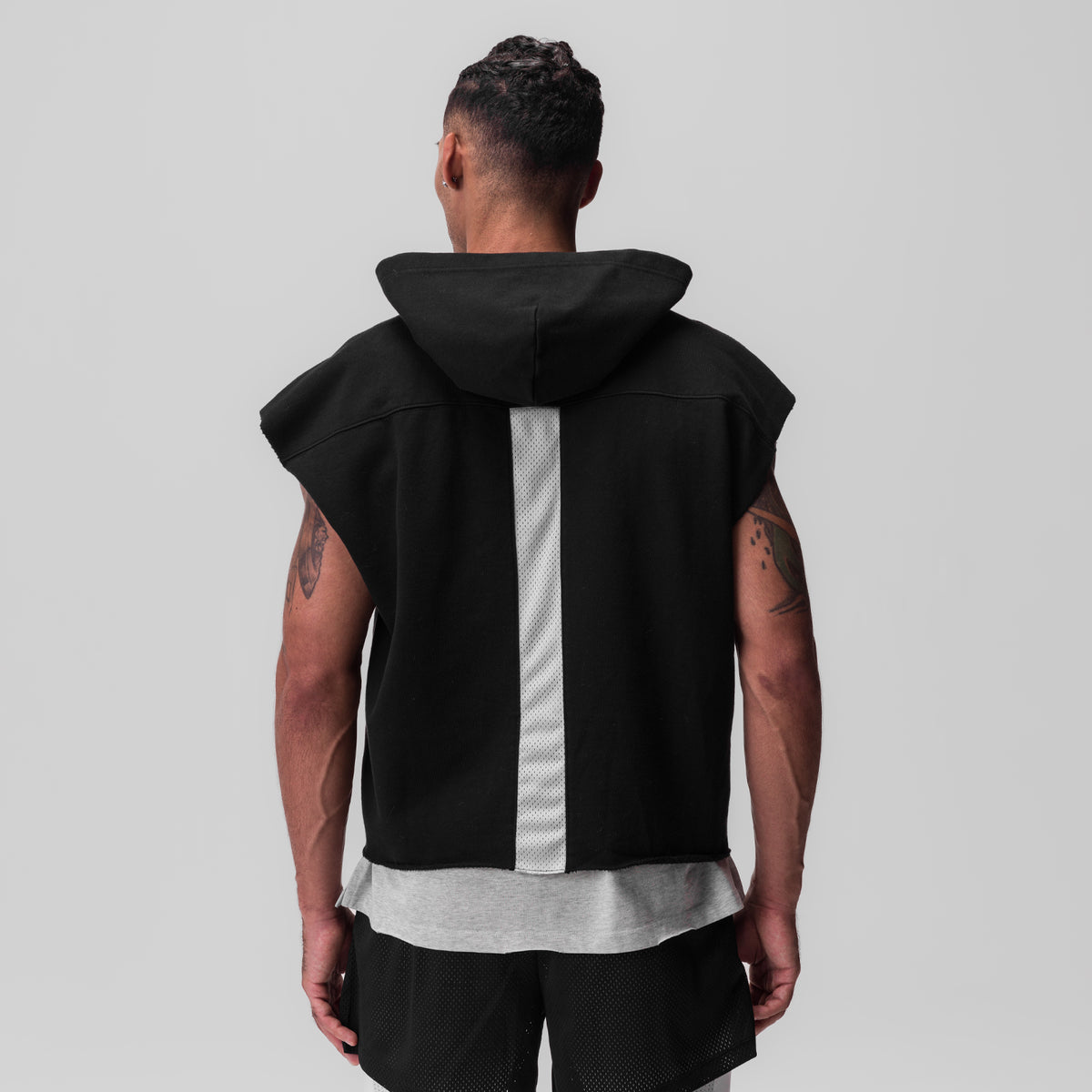 Tech Essential Raw Hem Cutoff Hoodie in black, back view on model