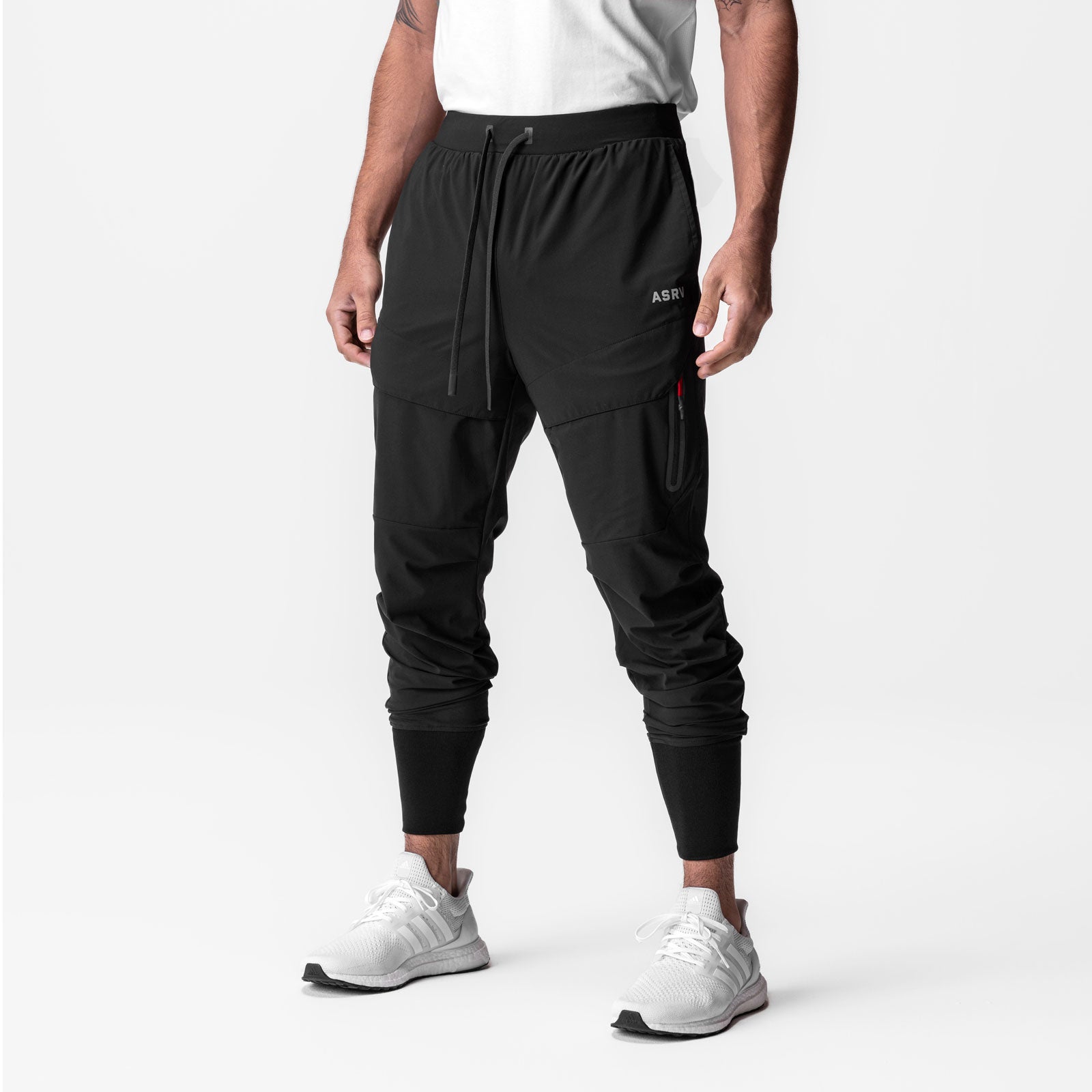 Tetra-Lite® Tech High Rib Jogger in black, worn by model, front view