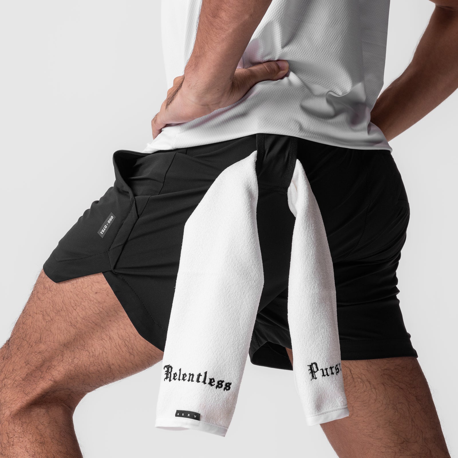 Tetra-Lite 5" Linerless Shorts in black worn with white towel, front view