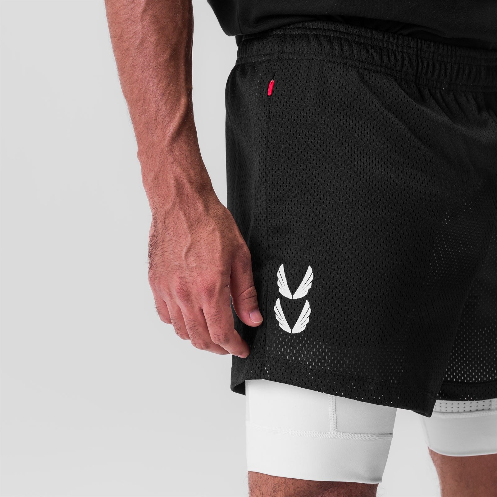 SilverPlus™ Mesh 5" Liner Short in black/white, side view on model