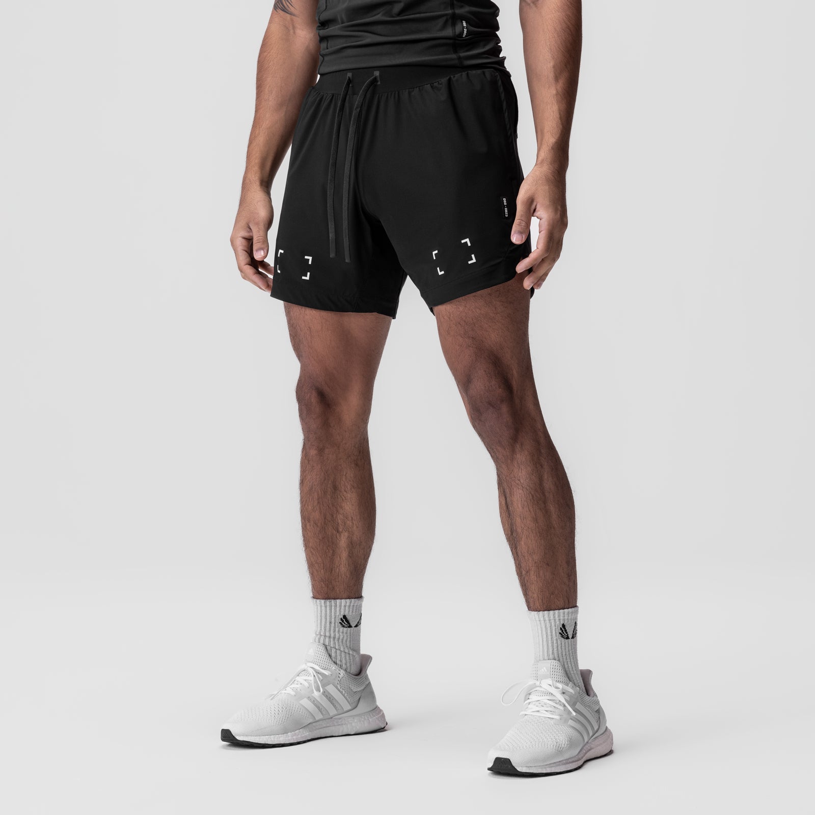 Tetra-Lite 7" Linerless Short in black with space bracket design, modeled on male figure