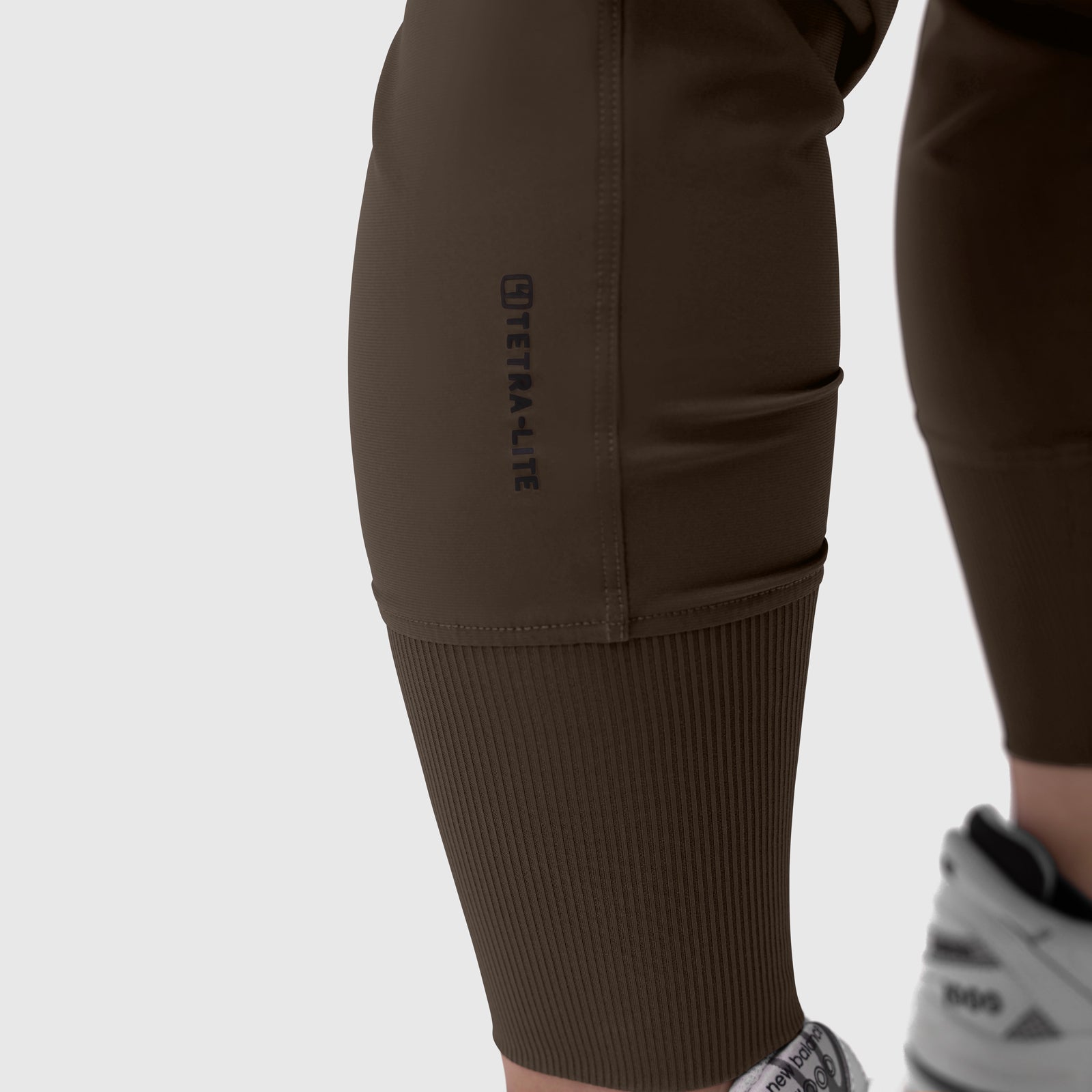 Tetra-Lite Cargo High Rib Jogger in Dark Earth, worn on model, side view