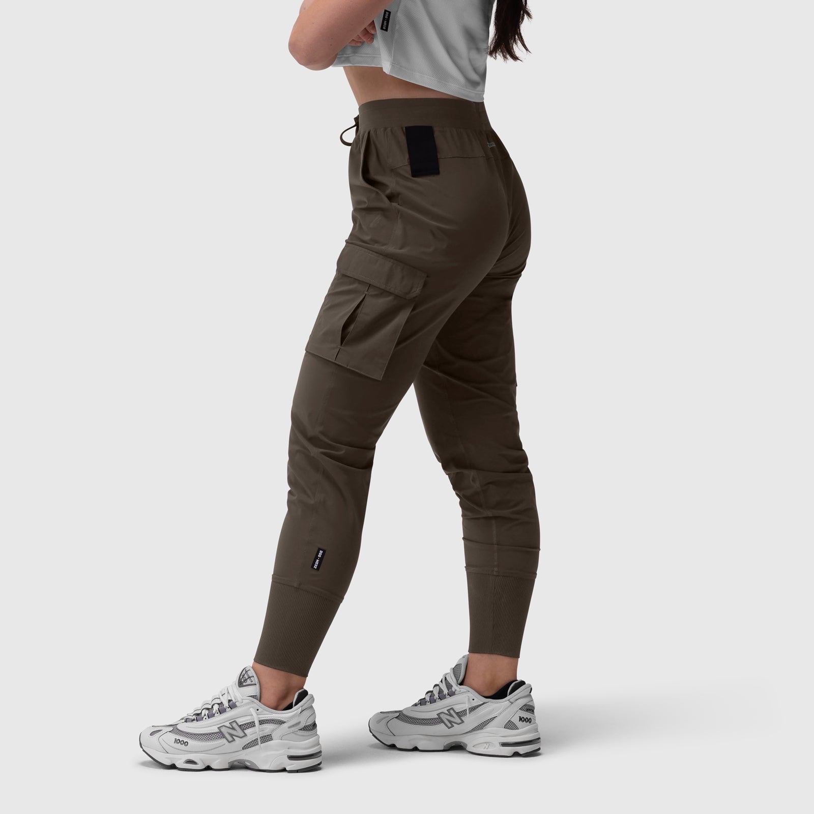 Tetra-Lite Cargo High Rib Jogger in Dark Earth, side view on model