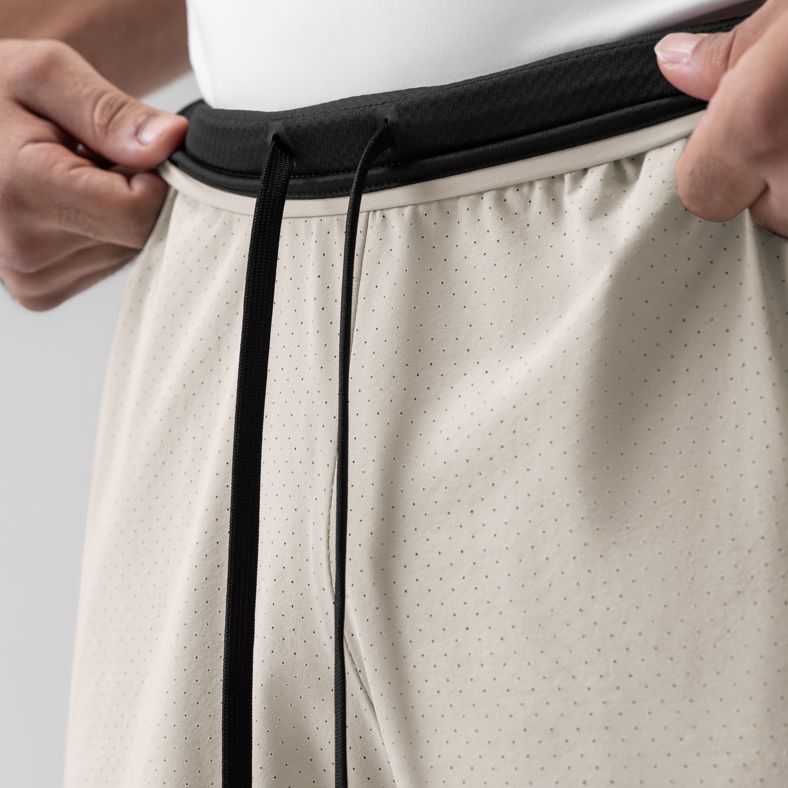 Aerotex Bonded 7" Liner Short in Chai, waistband detail being held