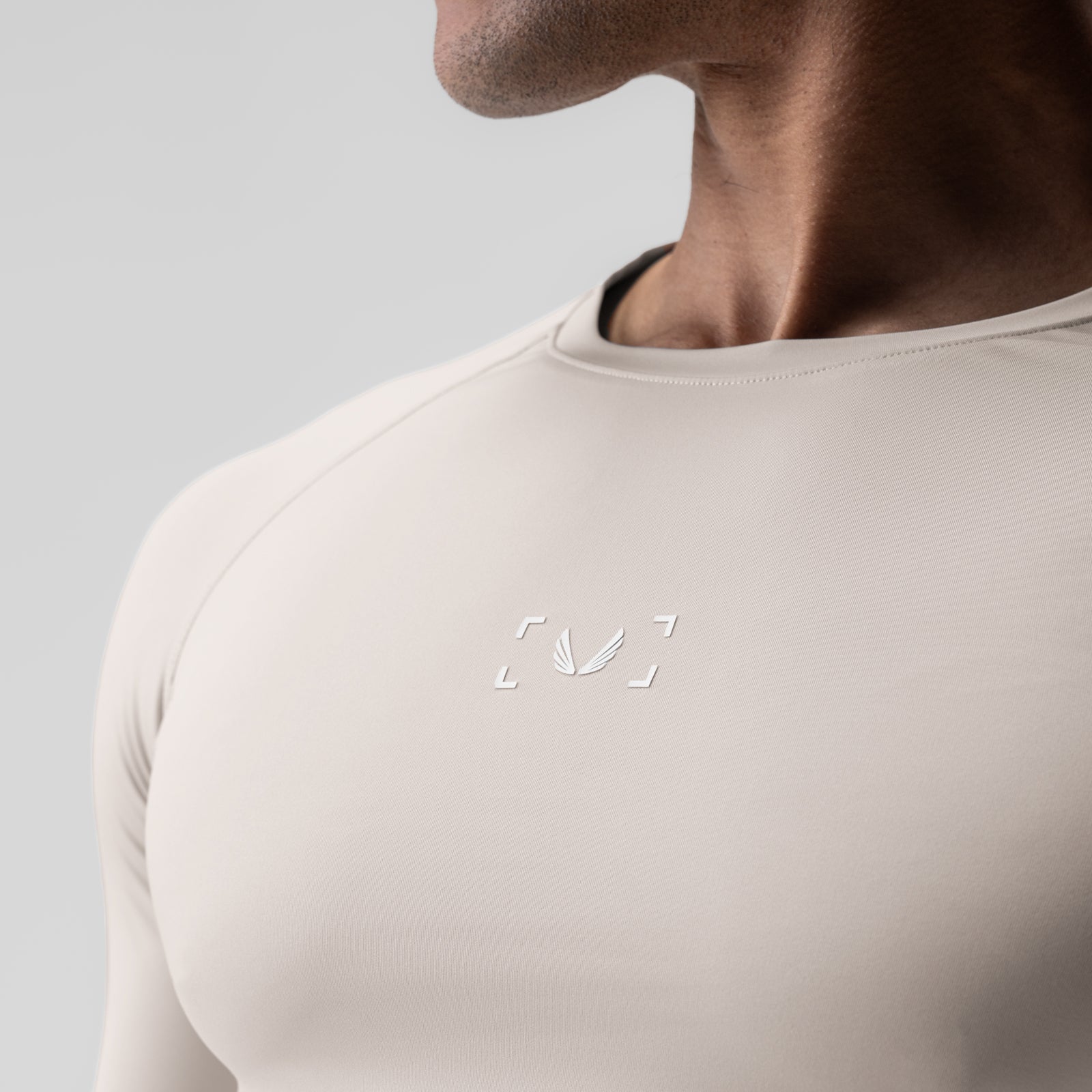 WarpFlexx-Lite Half-Sleeve Baselayer in chai, worn by model, chest detail view