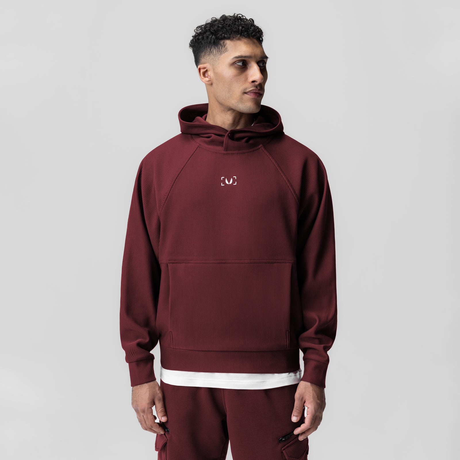 Deltapeak® Oversized Hoodie in crimson worn by model, front view