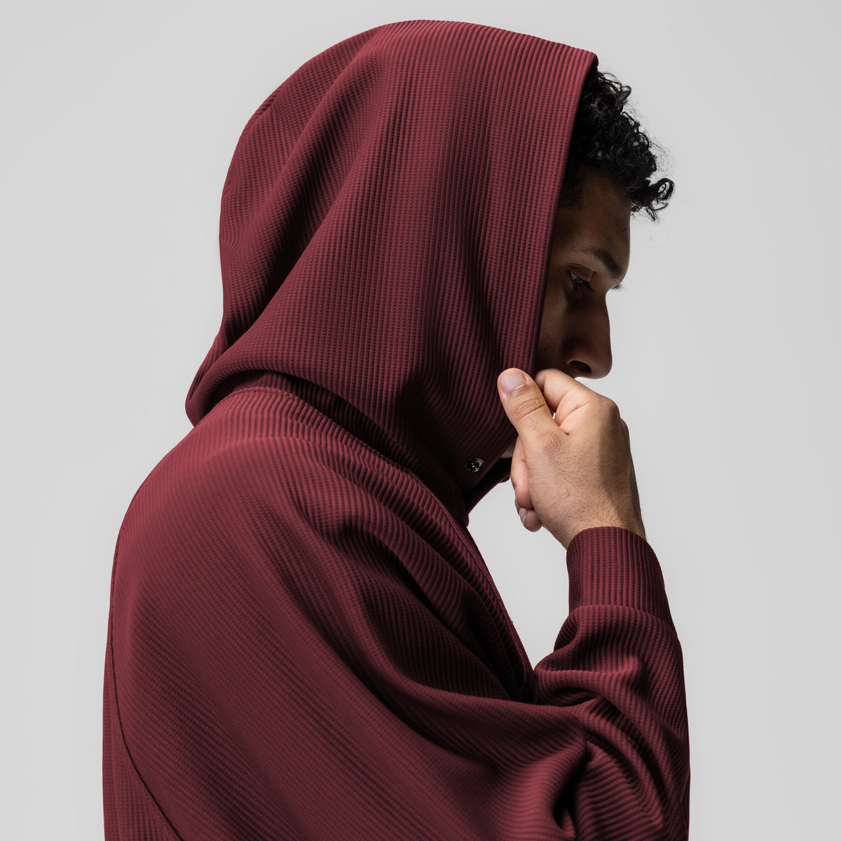 Deltapeak® Oversized Hoodie in crimson, worn by model in side profile with hood up