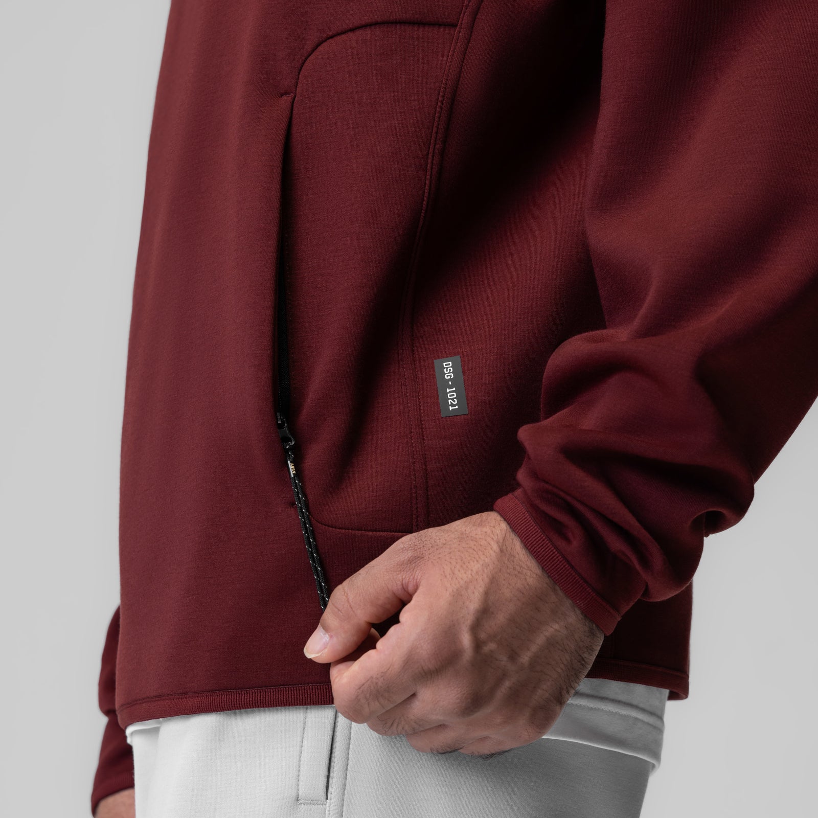 Dri-Core Quarter Zip in crimson worn by model, side detail view