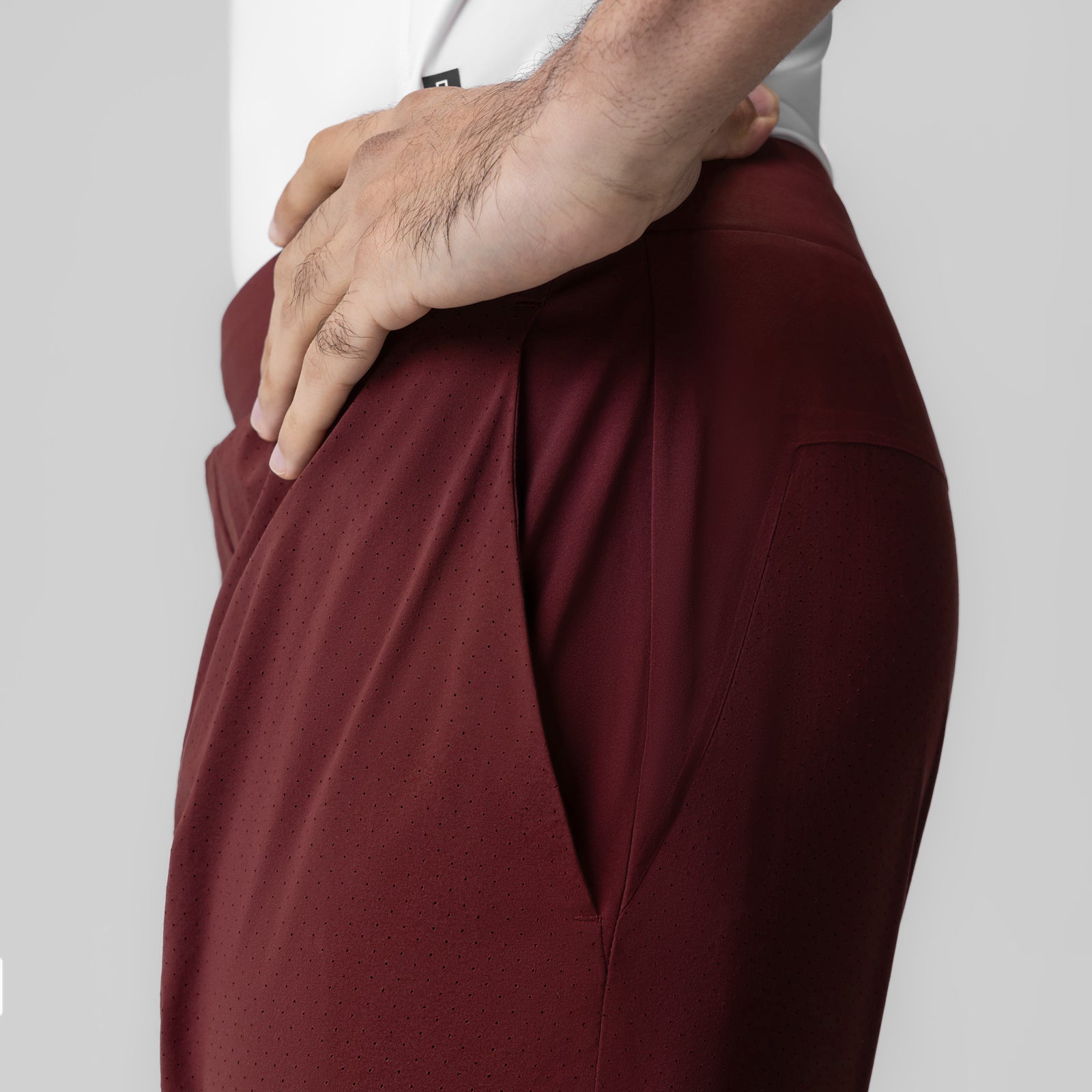 Aerotex Bonded 7" Liner Short in Crimson, worn by model showing side pocket detail