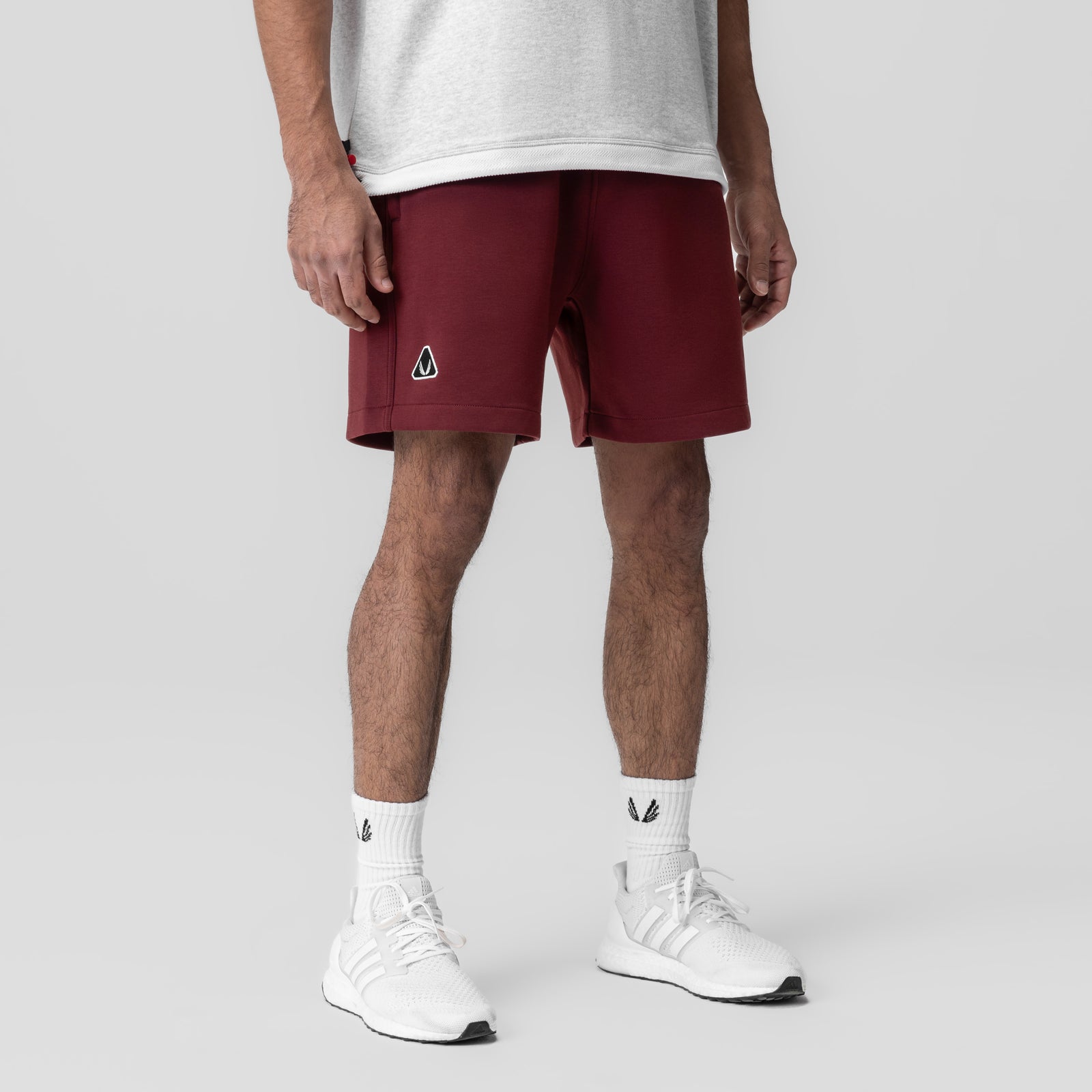 Dri-Core™ Training Short in crimson worn by model with white sneakers and socks