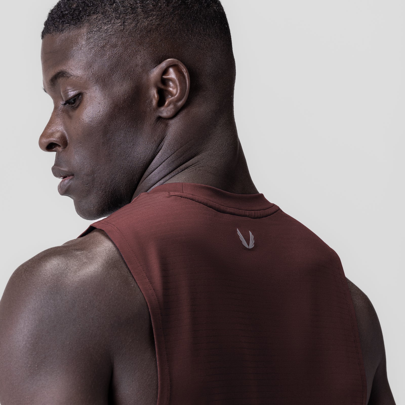 3D-Lite® 2.0 Lycra® Muscle Tank in crimson, worn by model in profile view