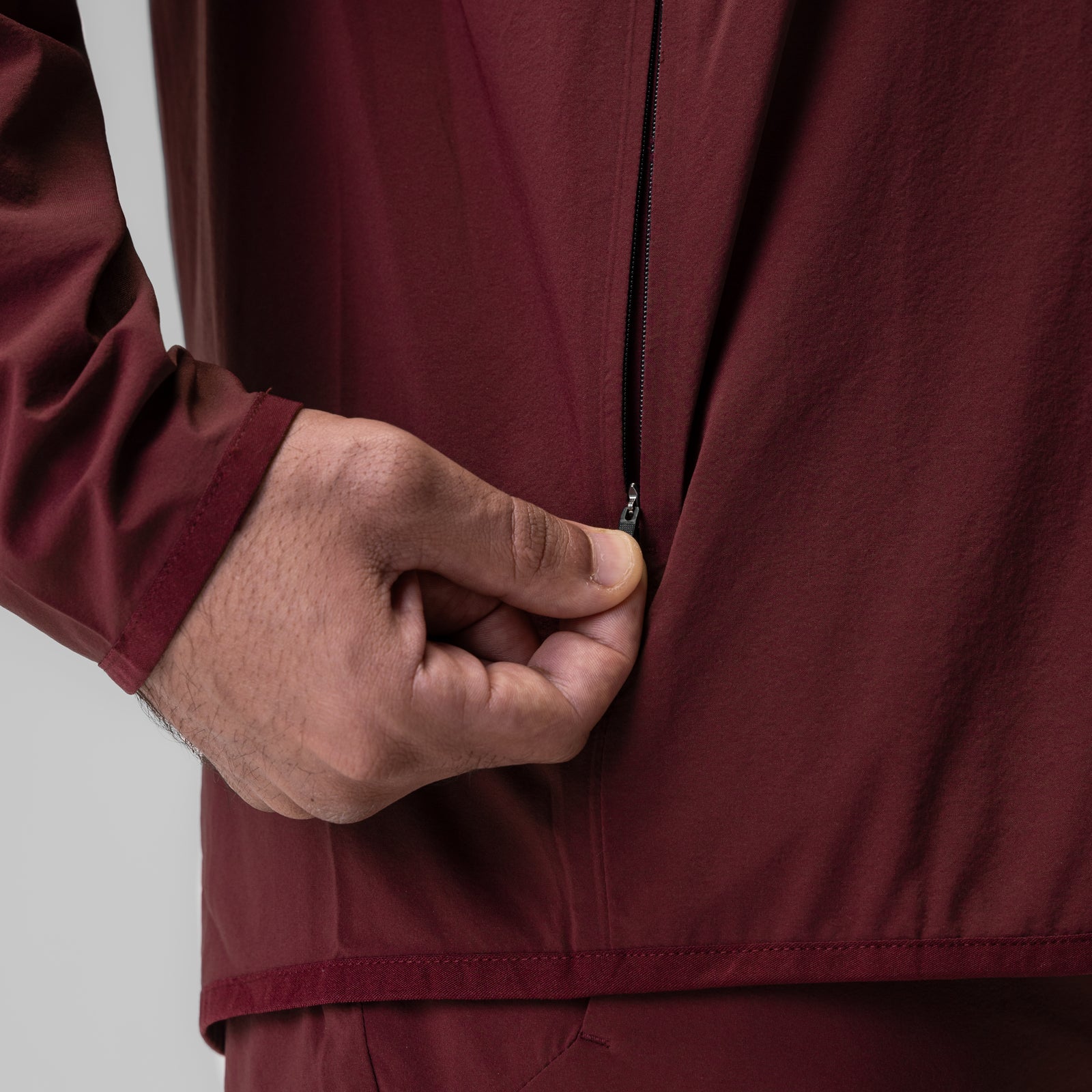 Crimson Aerotex Weather-Ready Bonded Windbreaker worn by model, front detail of hand in pocket