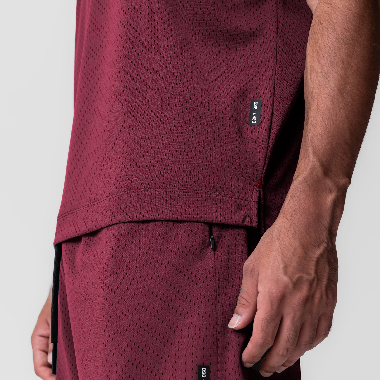 Reversible 2-in-1 Cutoff Hoodie in crimson worn by model, side detail view