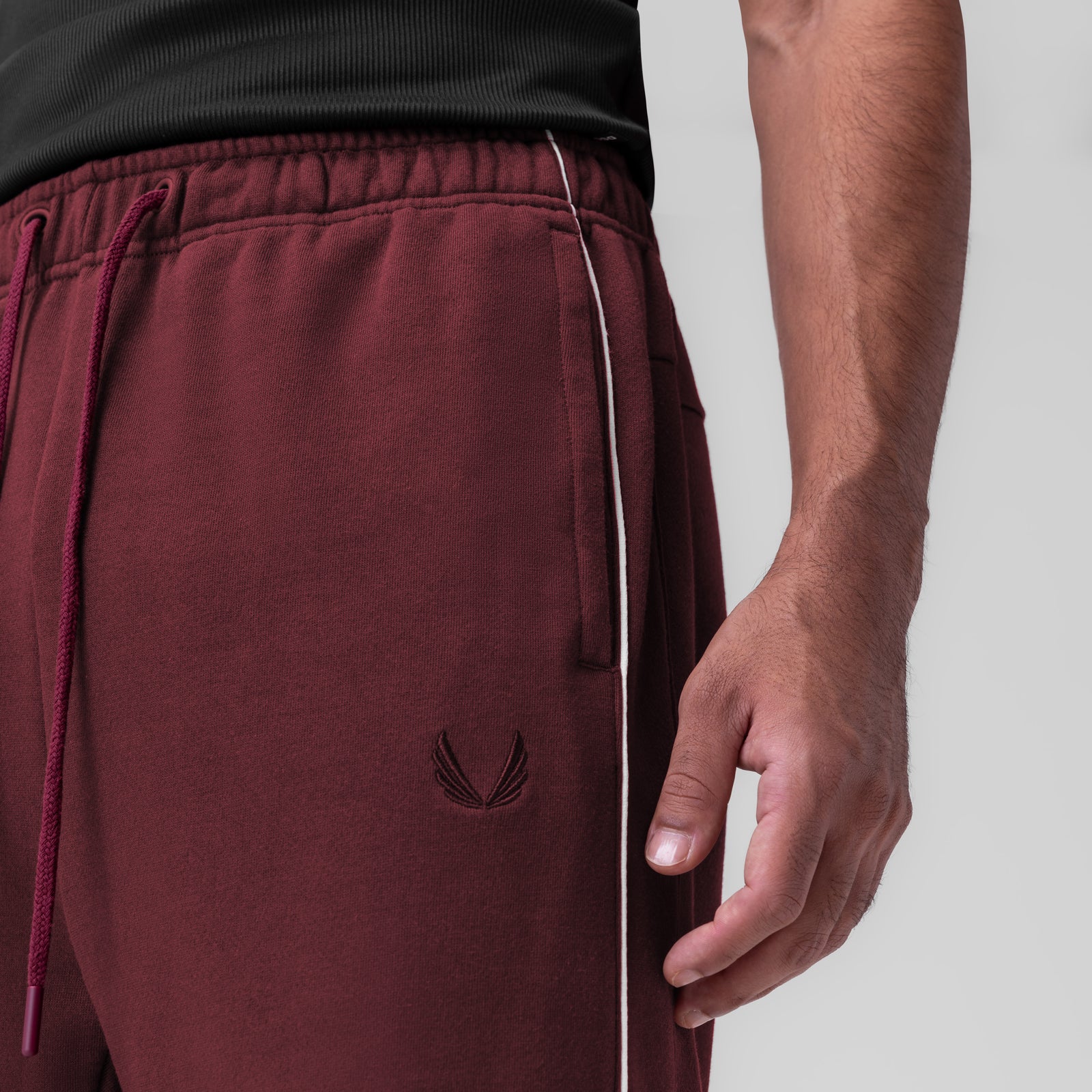 Herringbone Terry Snap Button Sweats in Crimson worn by model, side view detail