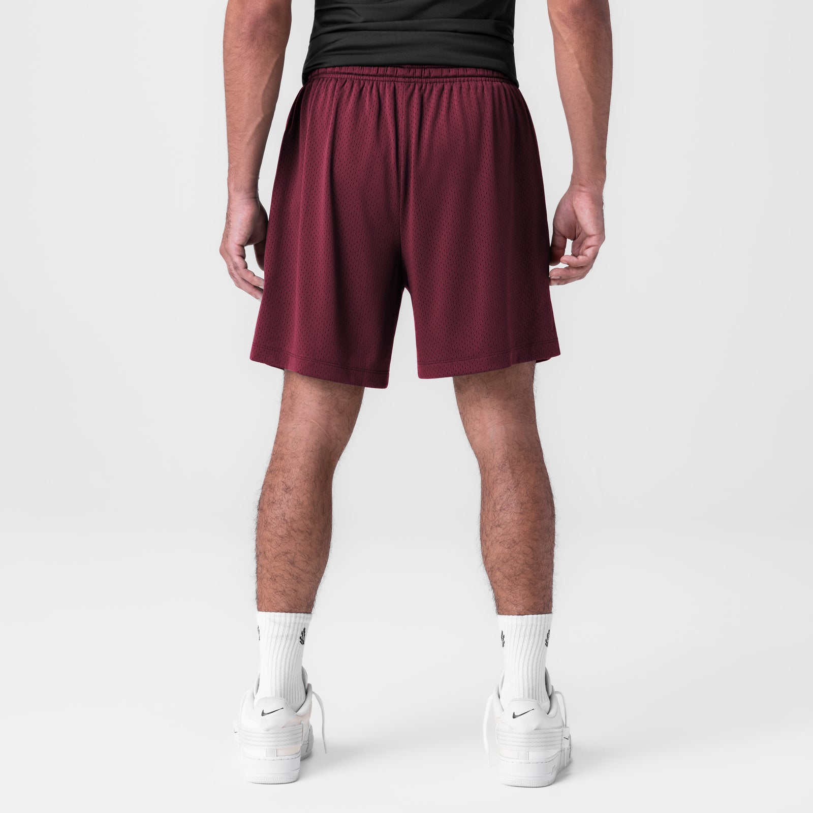 Reversible 2-in-1 Short in Crimson, back view on model with white socks