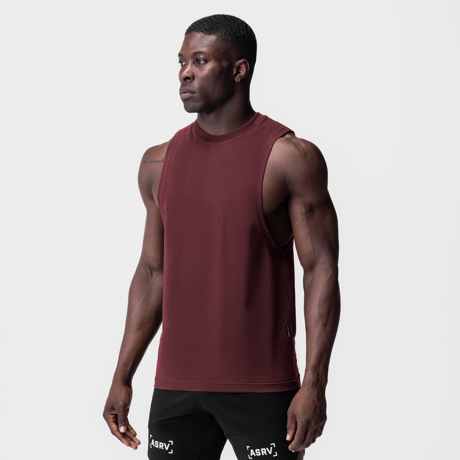 Crimson Supima® Muscle Tank worn by model, side view