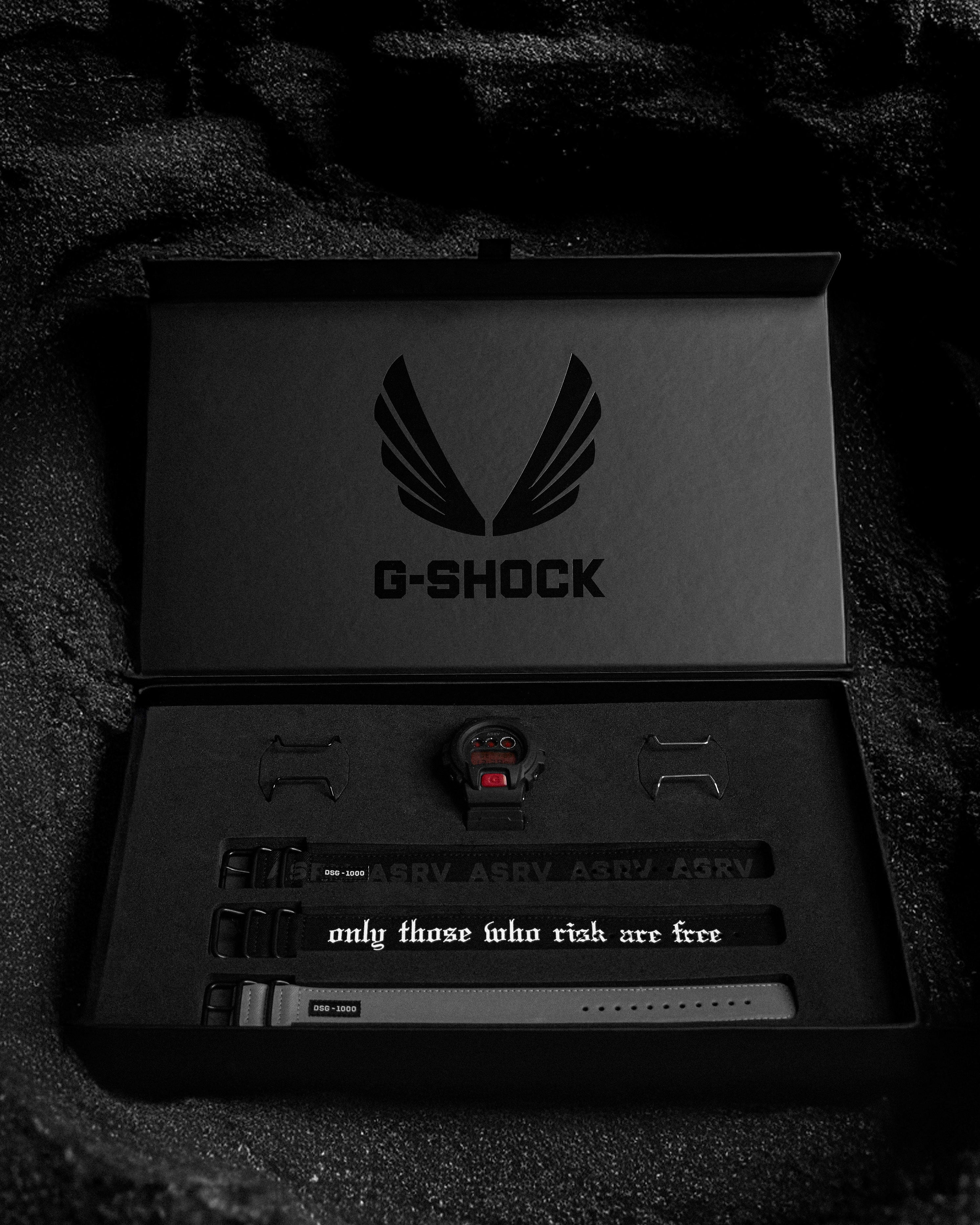 flatlay ASRV x G-SHOCK DW6900 watch set with bands and accessories in black, overhead view