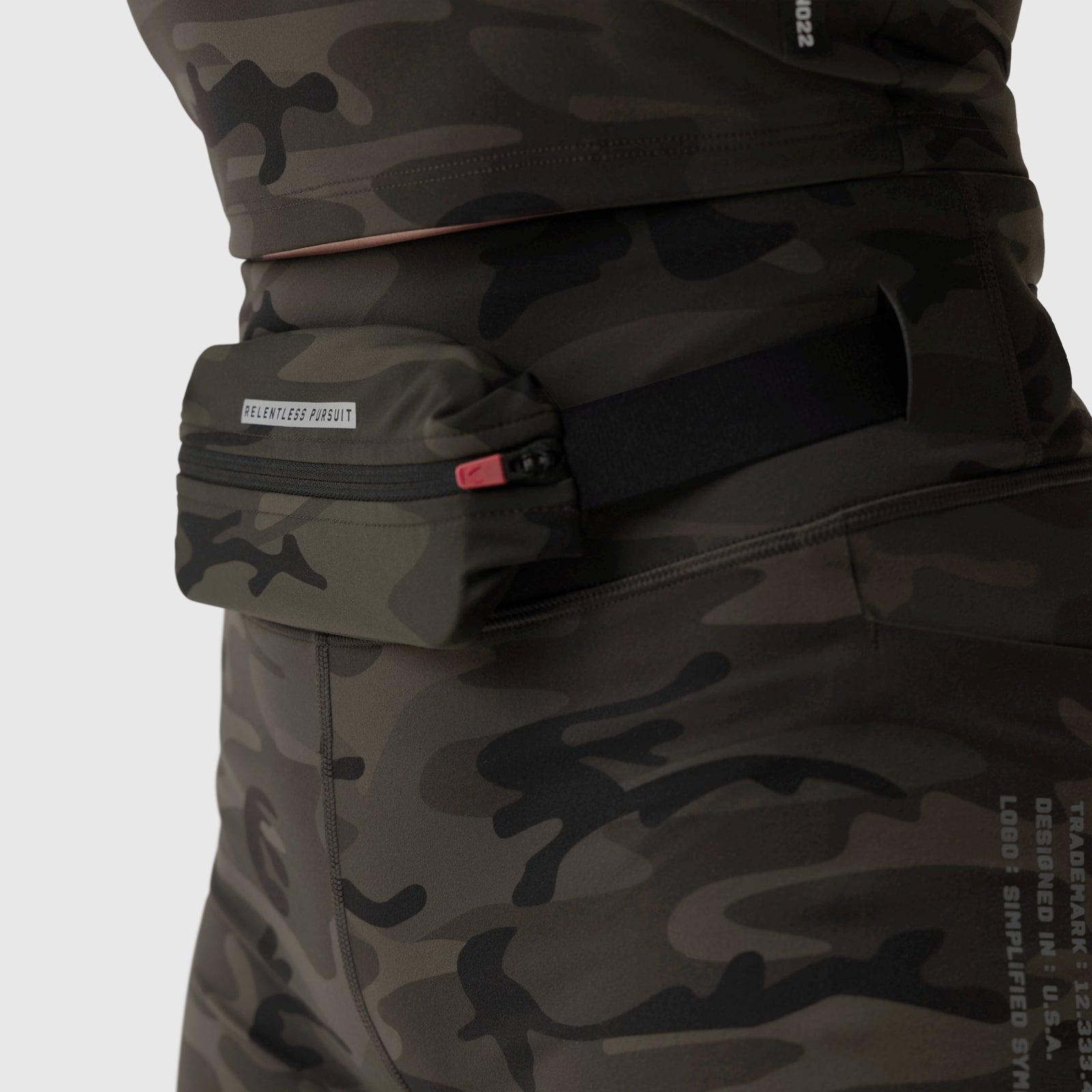 LYCRA® 3-in-1 Biker Short in Dark Camo worn with matching jacket, waist detail