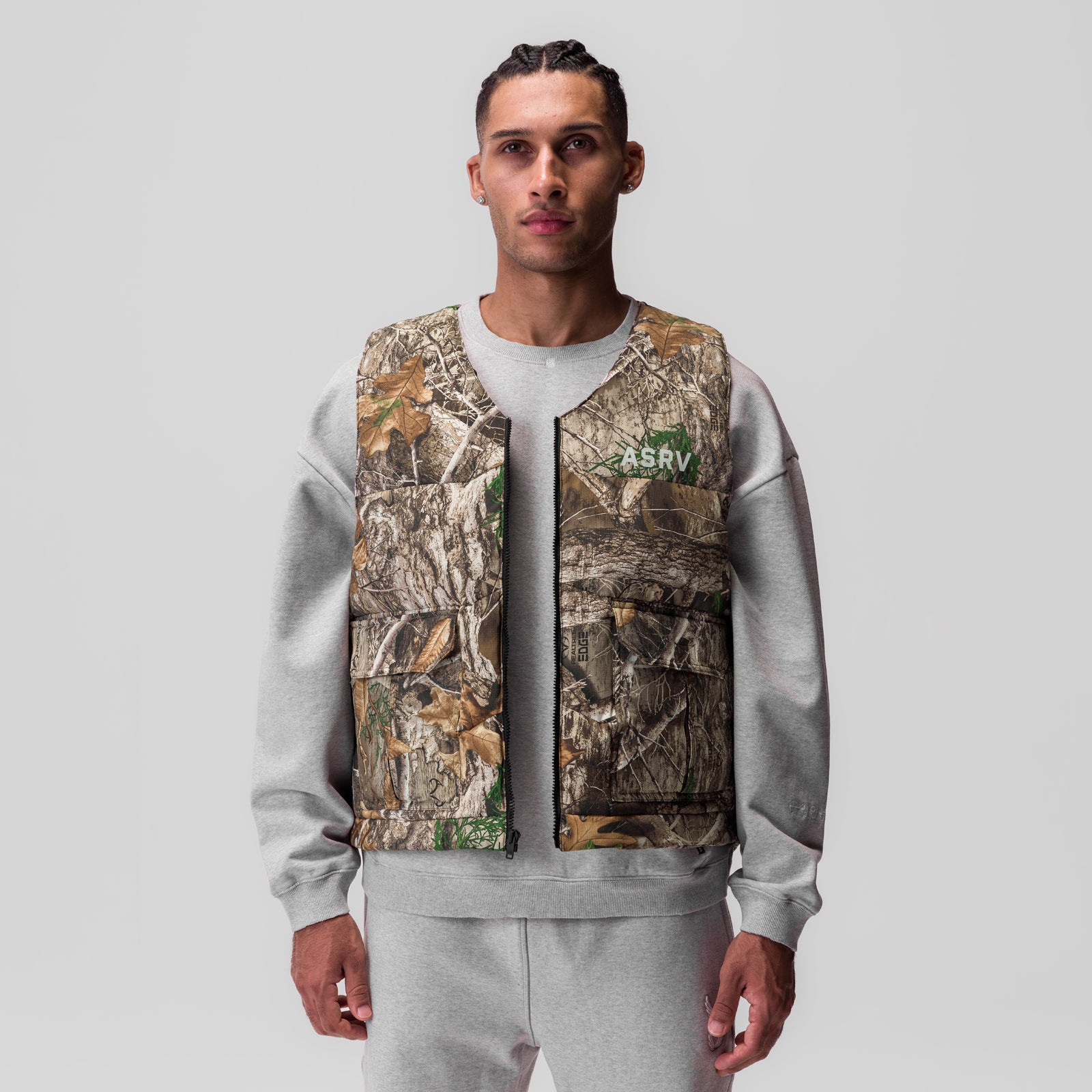Ripstop Insulated Puffer Gilet in Realtree Camo and grey, worn by model, front view
