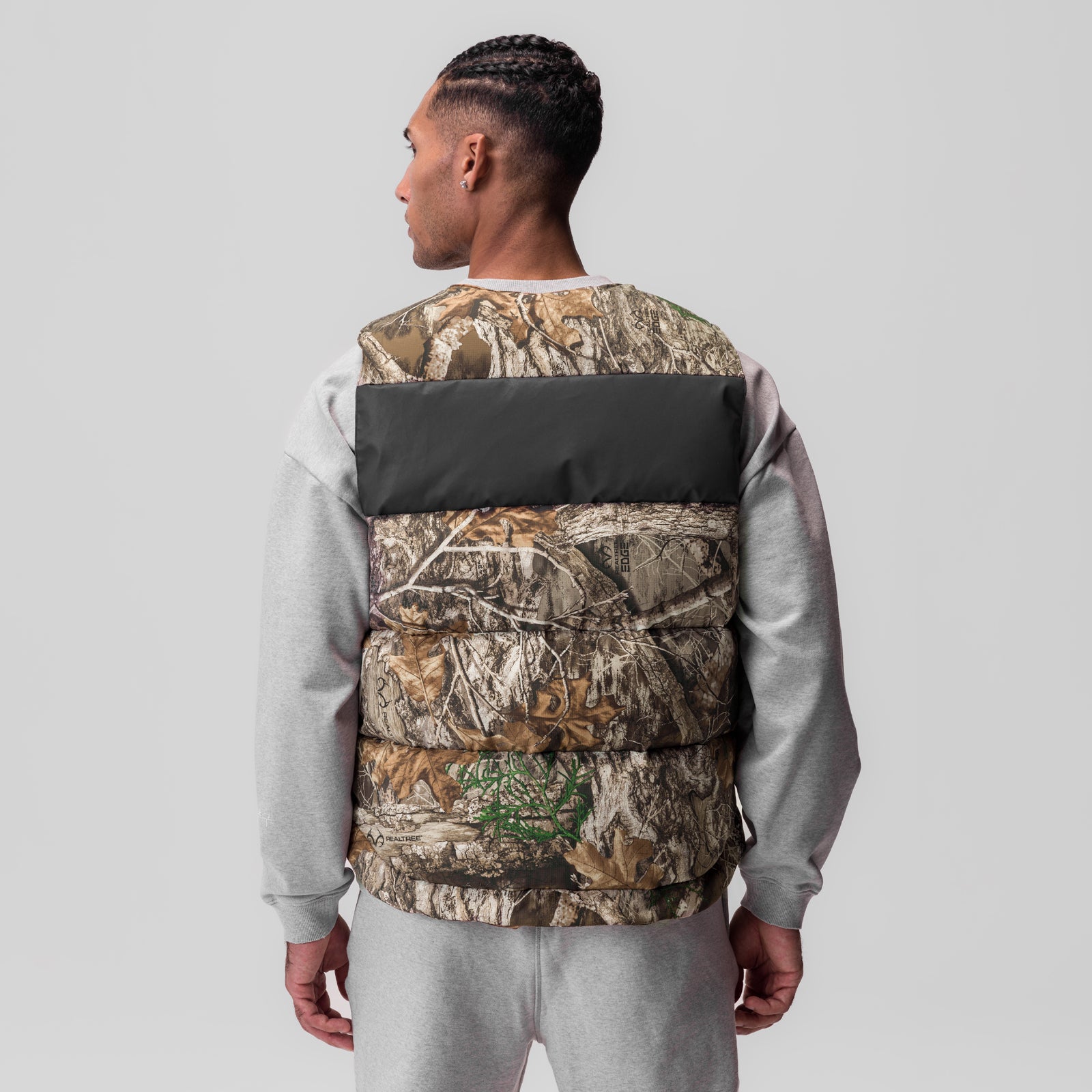Ripstop Insulated Puffer Gilet in Realtree camo with black stripe, back view on model