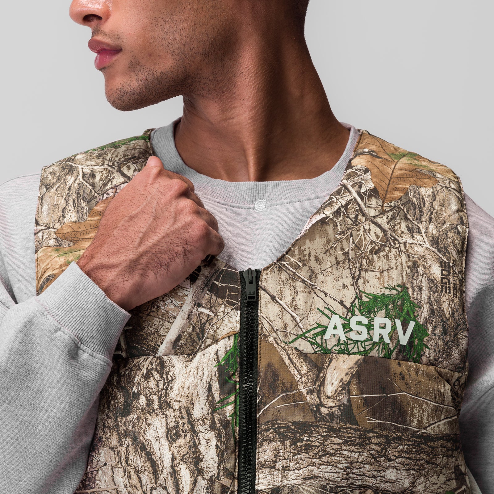 Ripstop Insulated Puffer Gilet in Realtree Camo, worn by model, side view