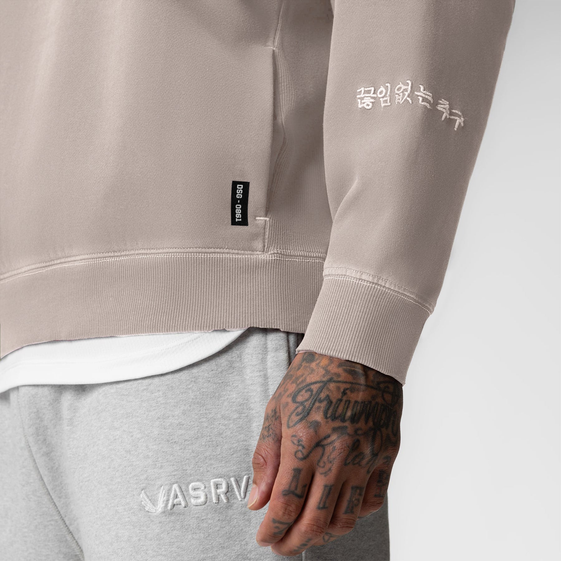Tech Essential Distressed Crewneck in Faded Chai worn by model, front detail view