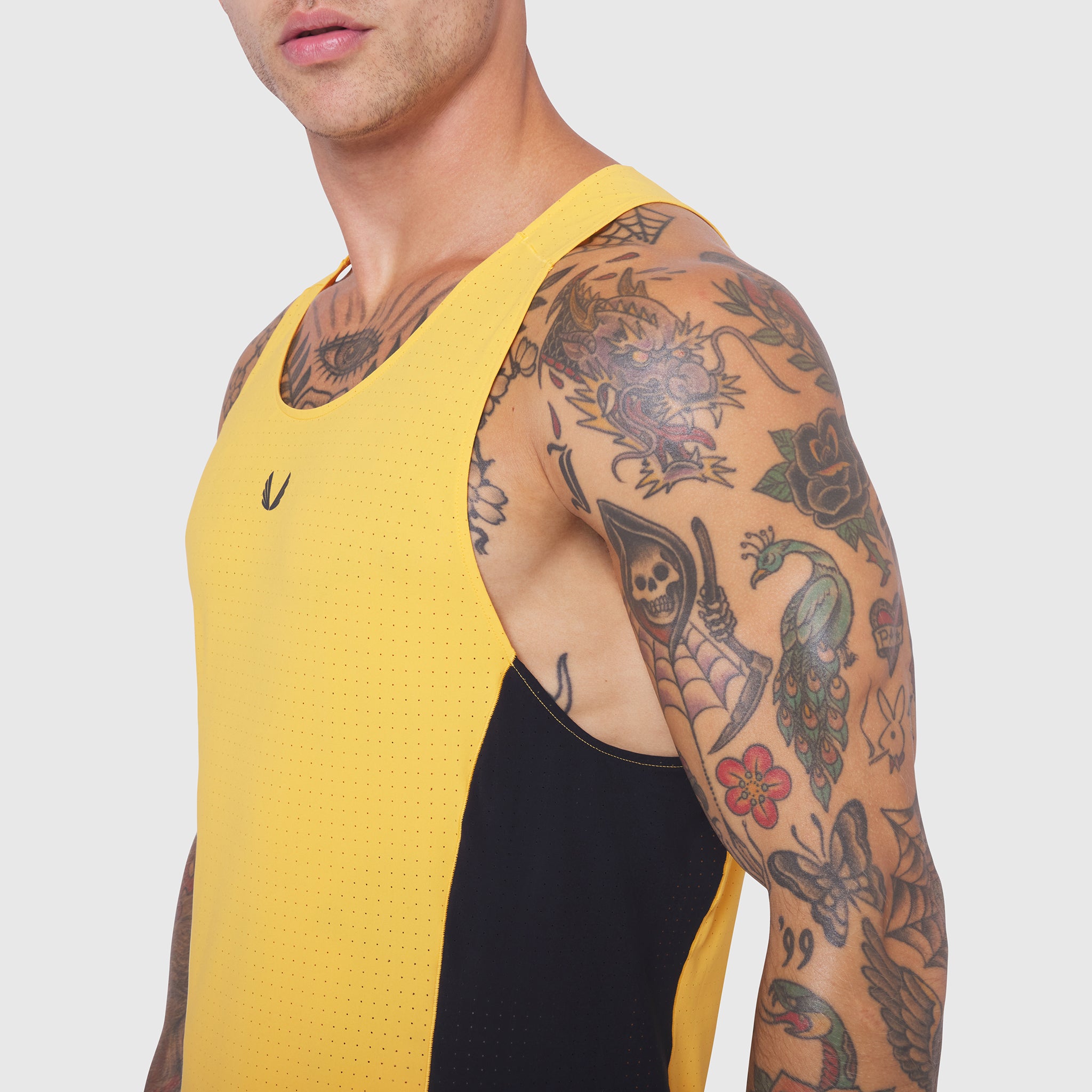 Laser-Vent Singlet Tank in amber and black, worn by male model showing side view