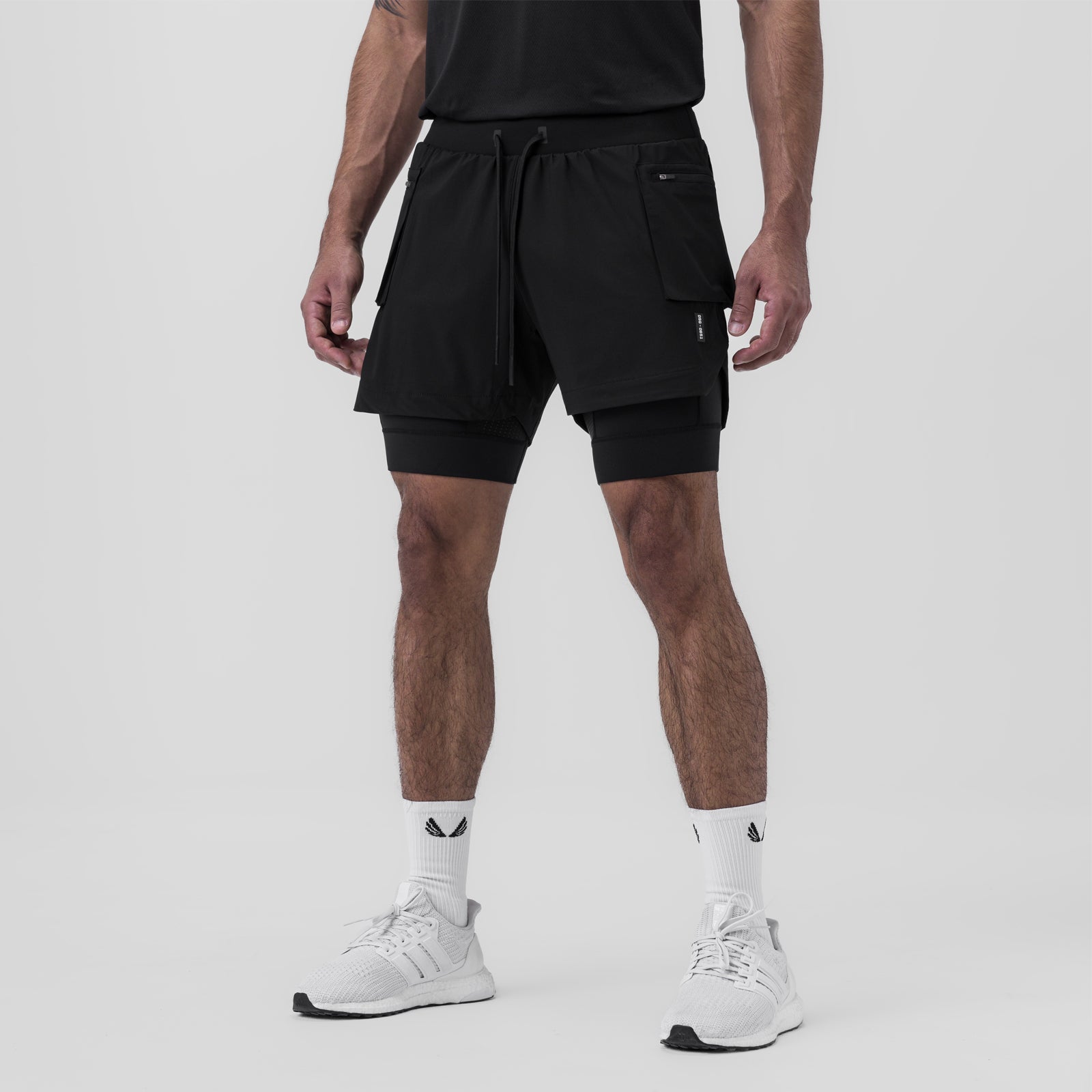 Tetra-Lite Liner Cargo Short in black, worn by model from behind, showing layered design