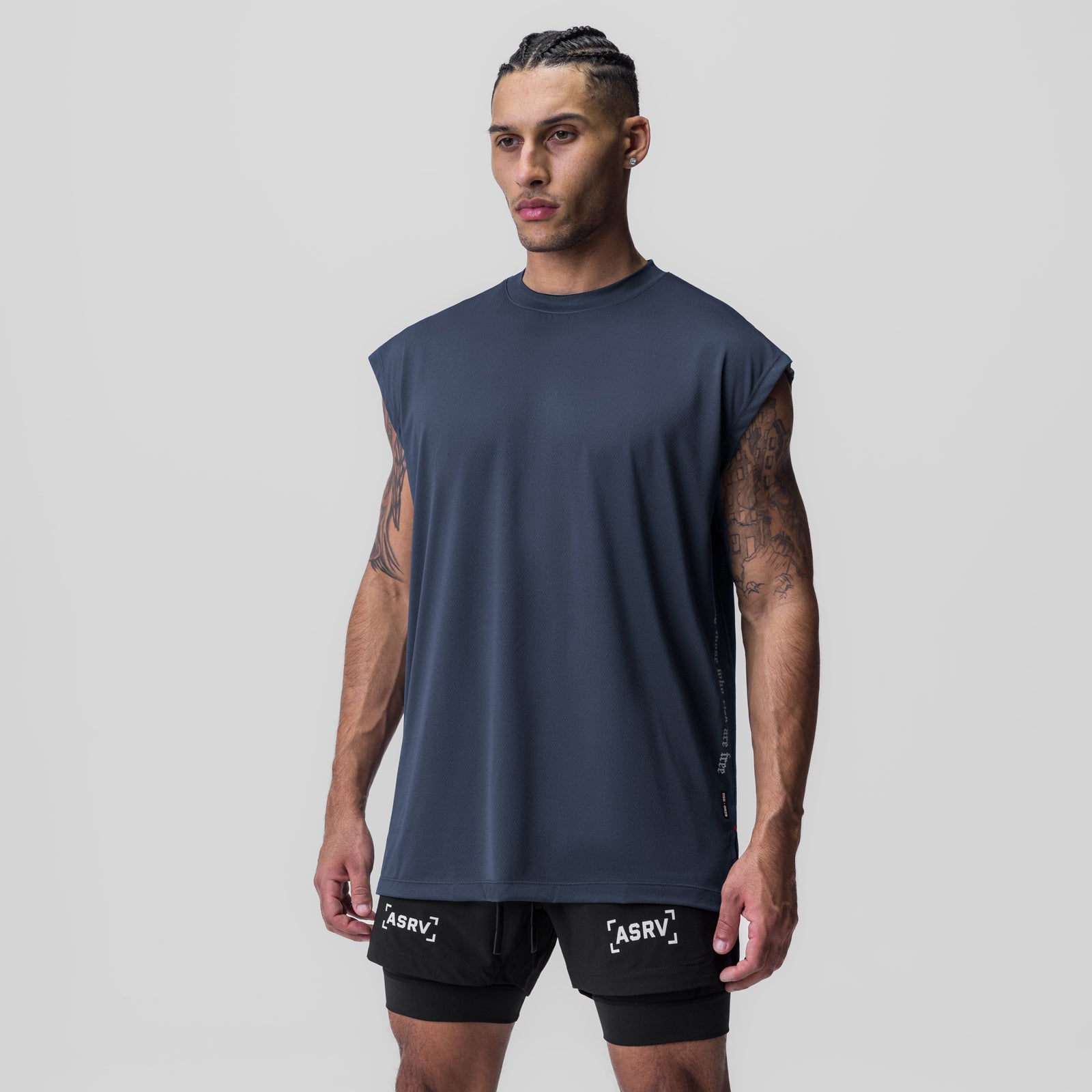 Silver-Lite 2.0 Oversized Cutoff tank in navy, worn by model standing facing forward